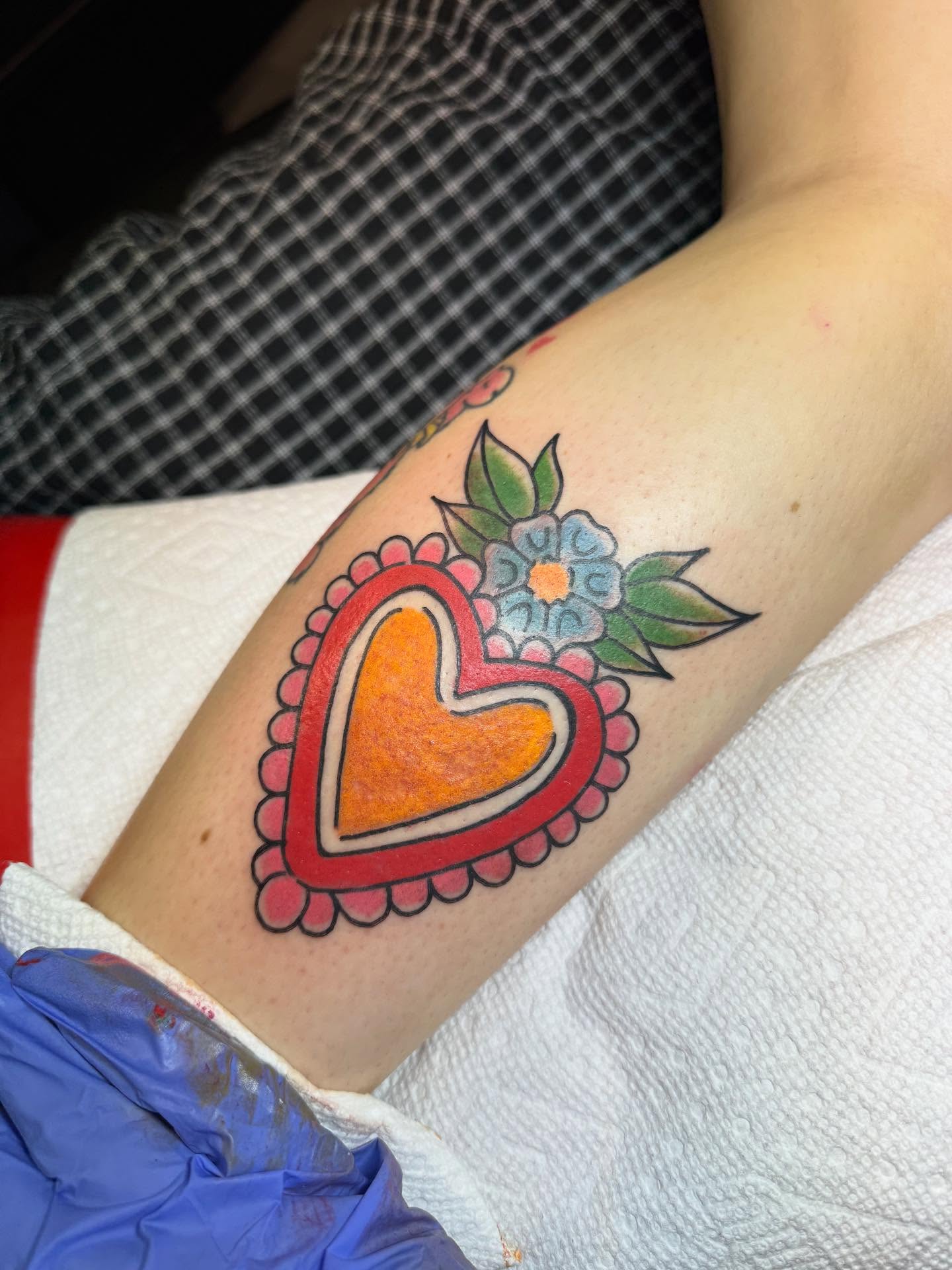 Heart with floral border American traditional tattoo on the forearm by 𝗞𝗮𝘁 𝗕𝗹𝗮𝗻𝗸𝗲𝗻𝘀𝗵𝗶𝗽