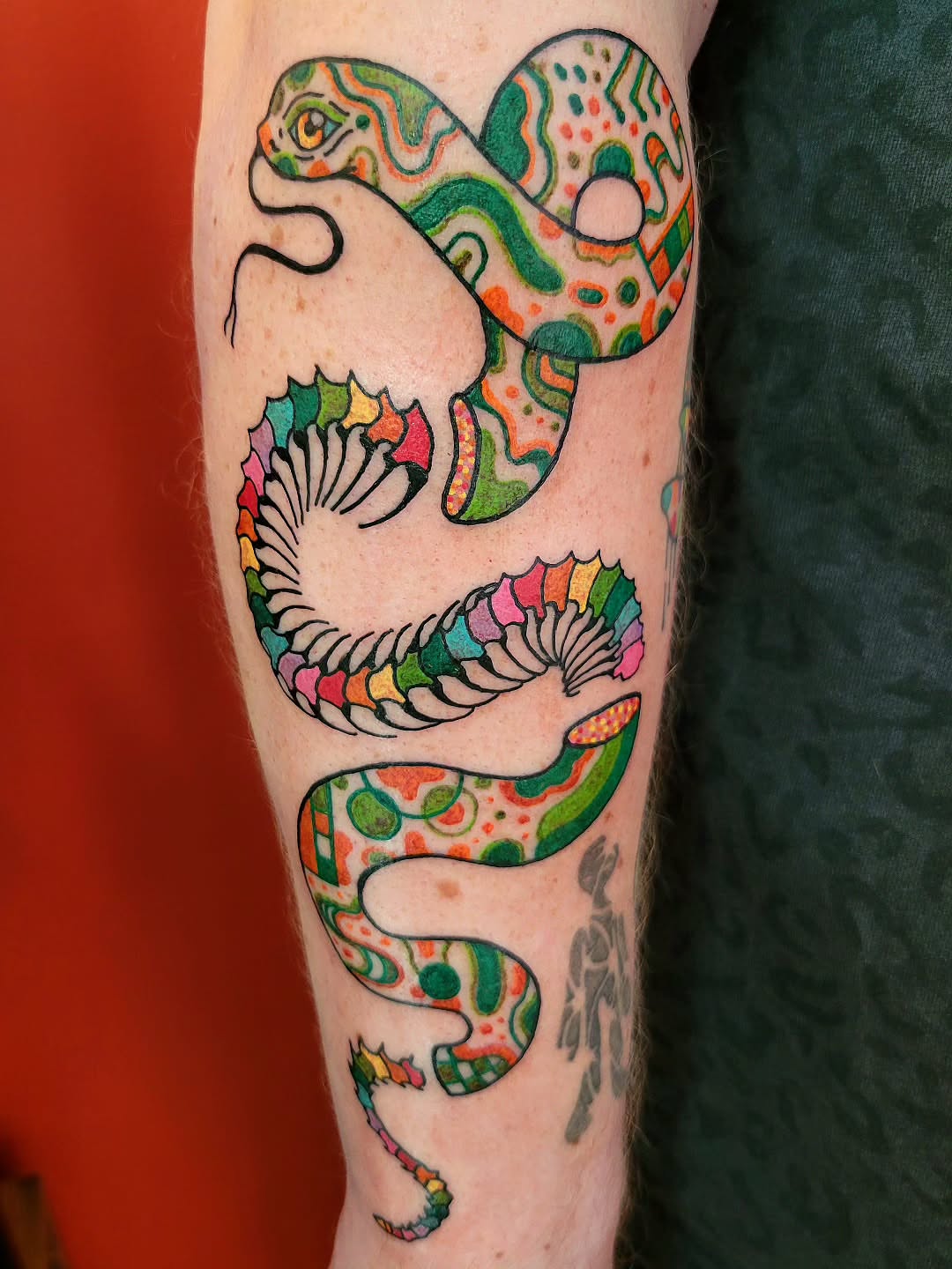 Snake new school tattoo on the forearm by Cat Wong意藝