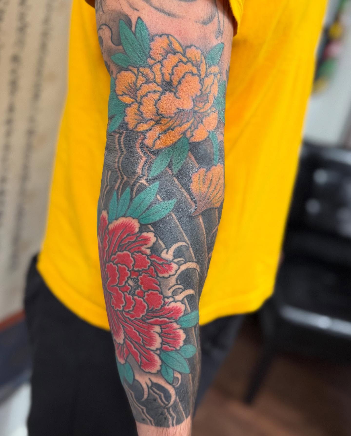 Peony flowers japanese irezumi tattoo on the forearm by Jason Eisenberg