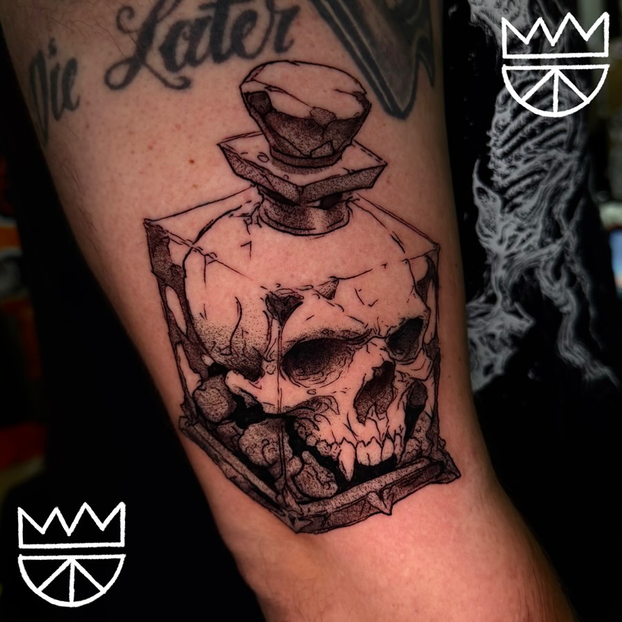 Skull perfume bottle dotwork tattoo on the forearm by Prncjordn, Stallings, North Carolina