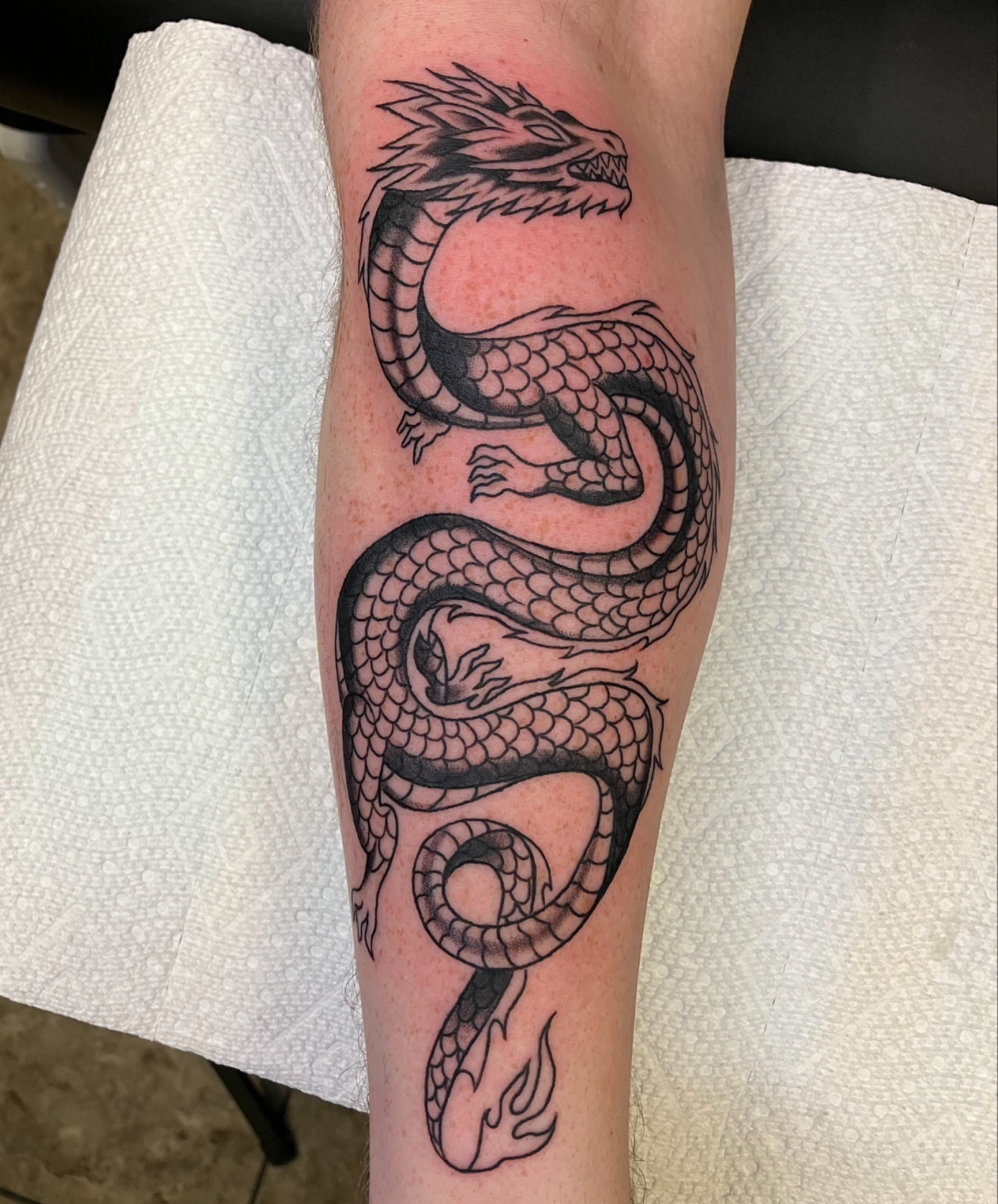 Dragon black and grey tattoo on the forearm by maddie mcghee, Memphis, Tennessee