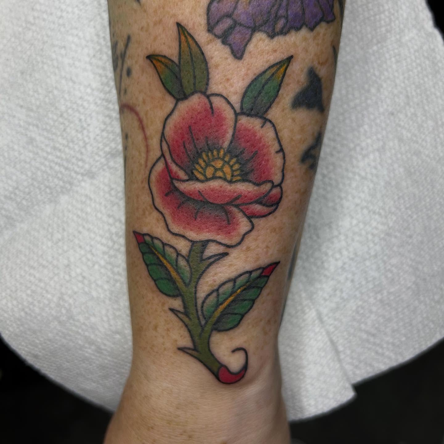 Flower American traditional tattoo on the forearm by Bregan ✨