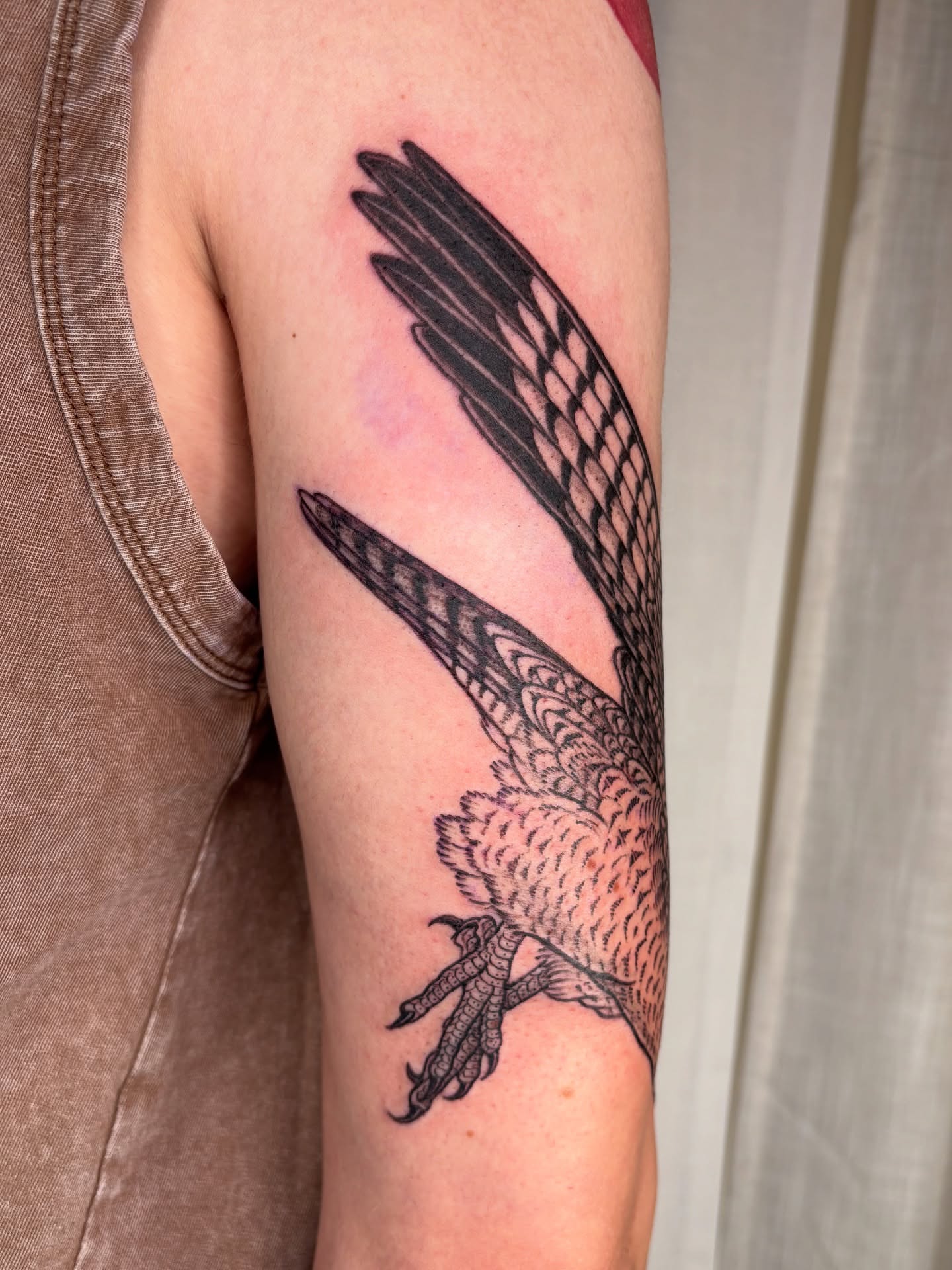 Bird black and grey tattoo on the forearm by Maggie