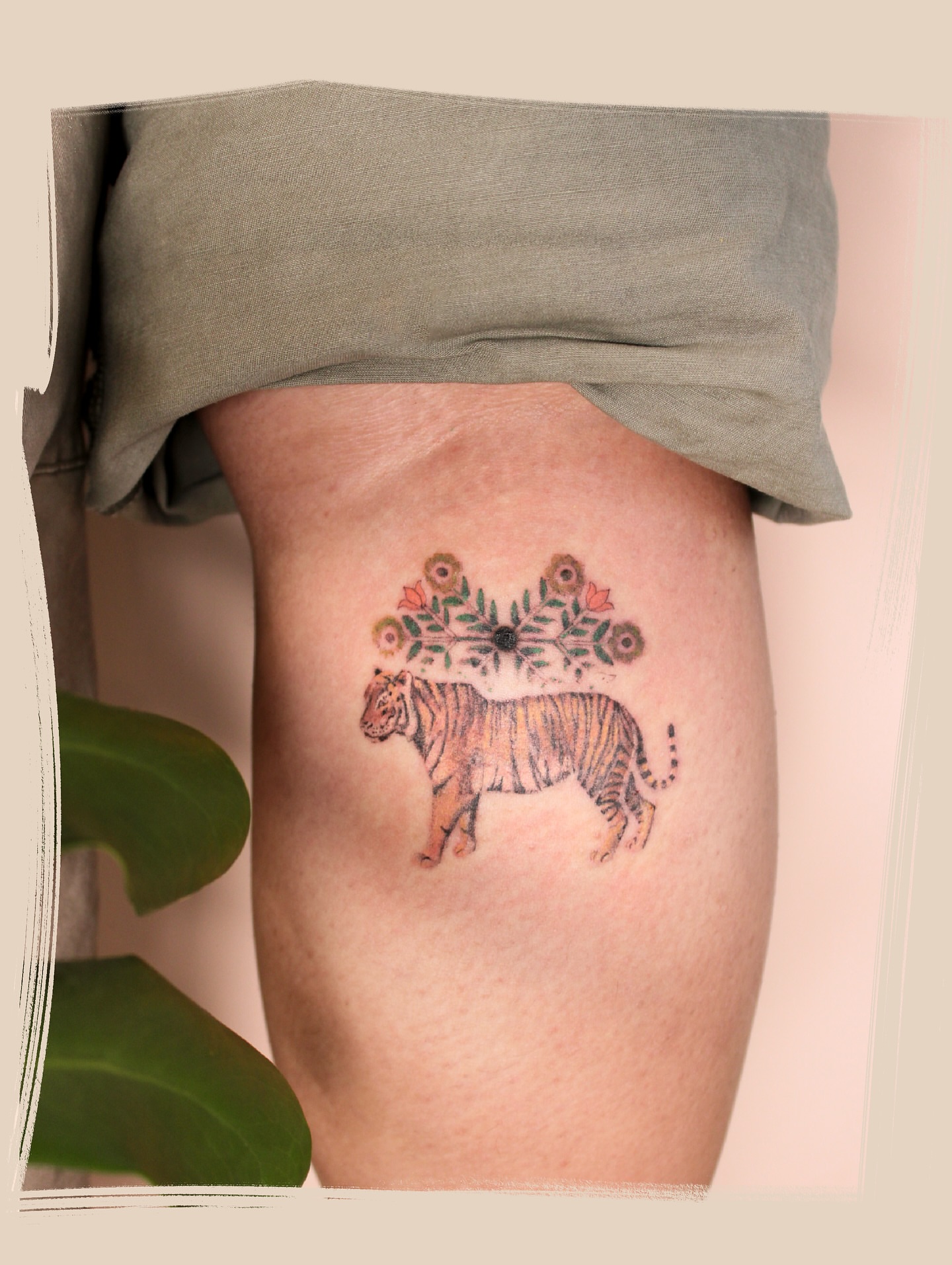 Tiger with floral crown new school tattoo on the thigh by Micah Light (color micro realism, Los Angeles, California