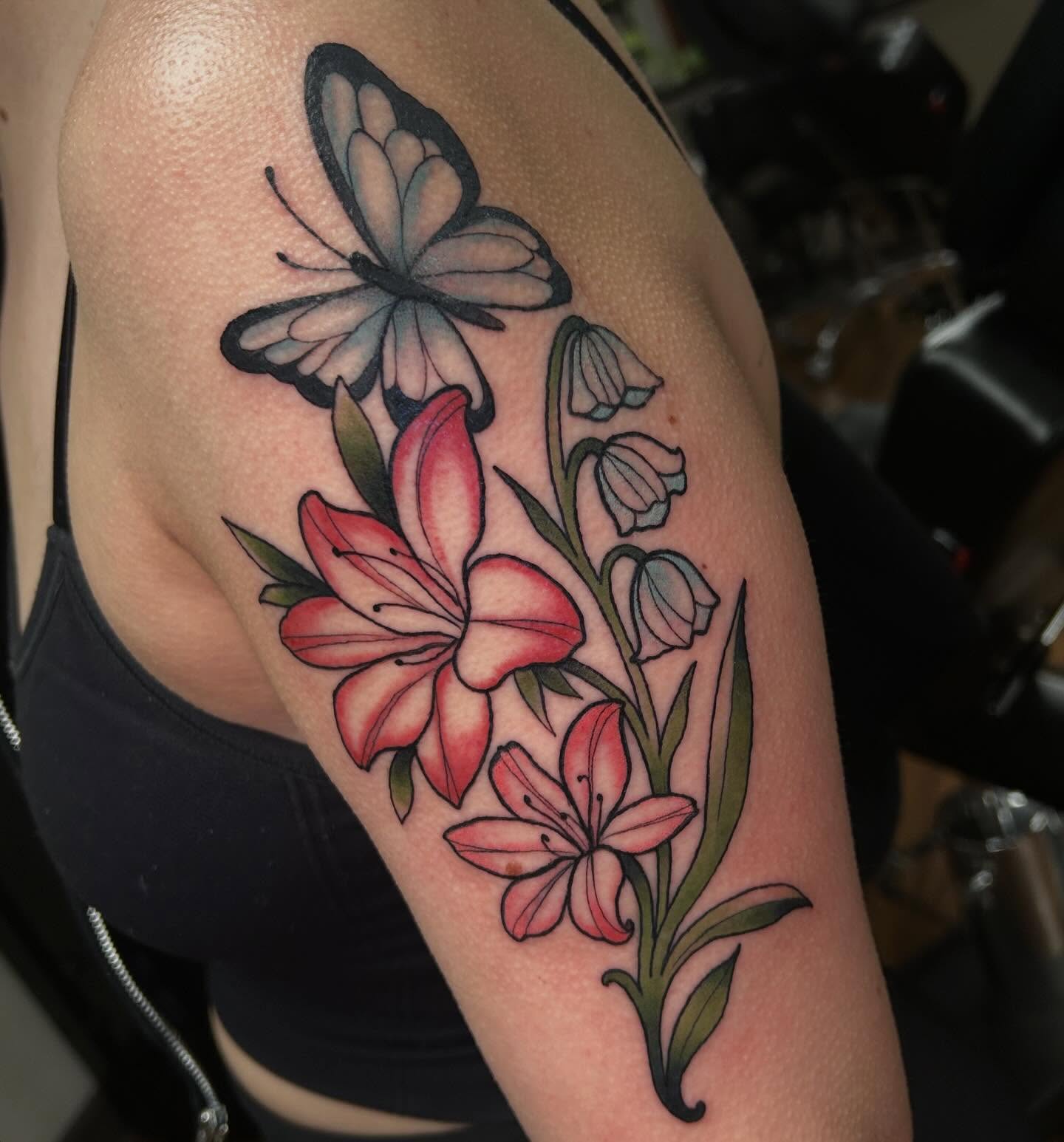 Flowers and butterfly American traditional tattoo on the shoulder by 𝕸𝖞𝖆