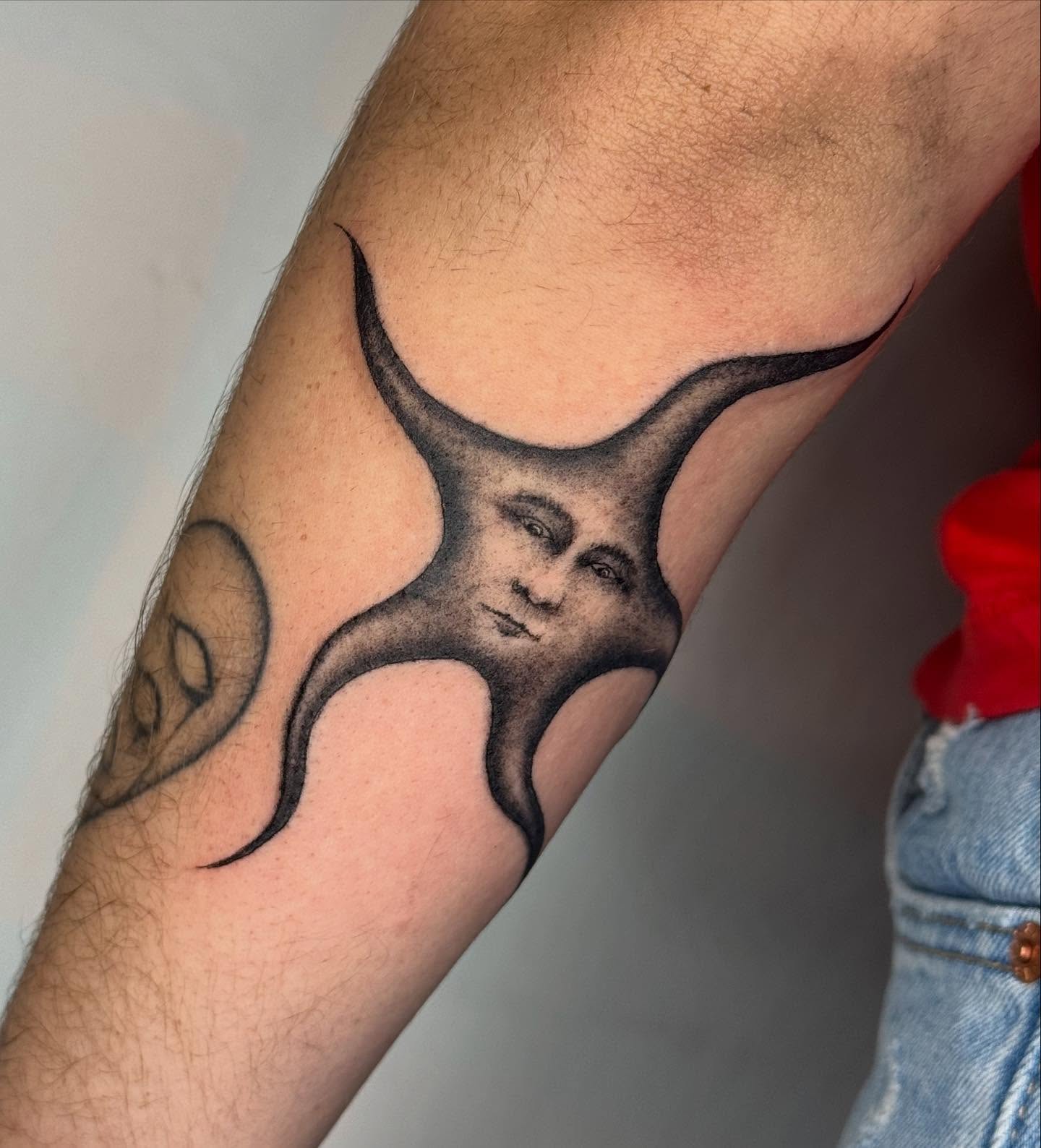 Abstract face surrealism tattoo on the forearm by @mr.smiley___