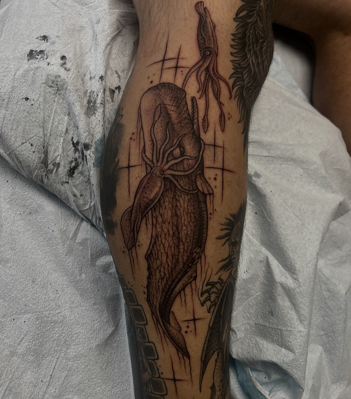 Squid and octopus realism tattoo on the forearm by Austin Tattoo Artist