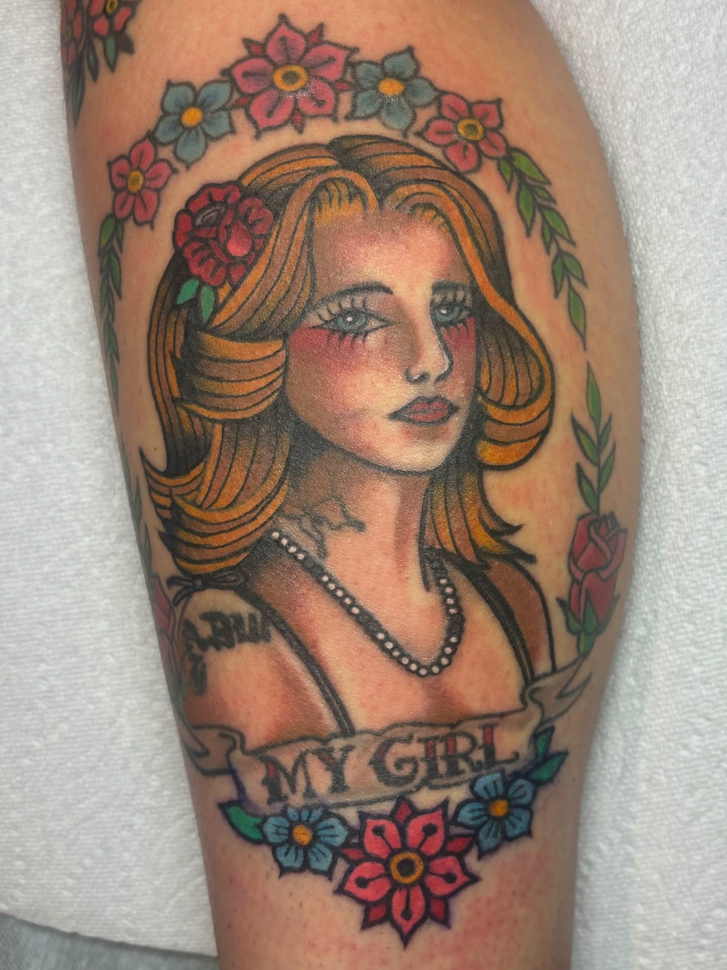 Portrait of a woman American traditional tattoo on the thigh by edith🌷, Murfreesboro, Tennessee