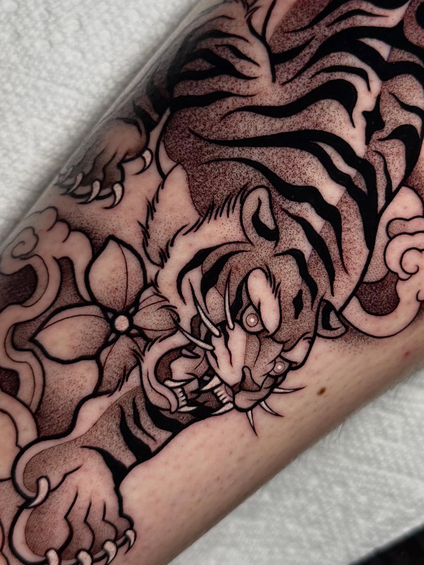 Tiger dotwork tattoo on the forearm by Bell Bolton