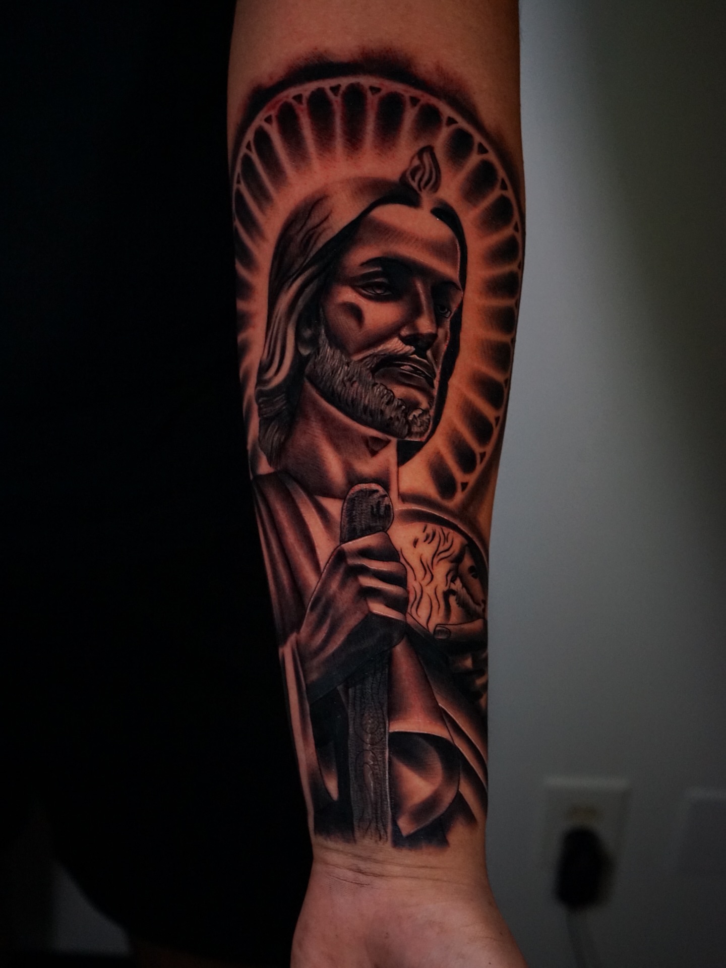 Religious figure black and grey tattoo on the forearm by Aaron Saenz jr