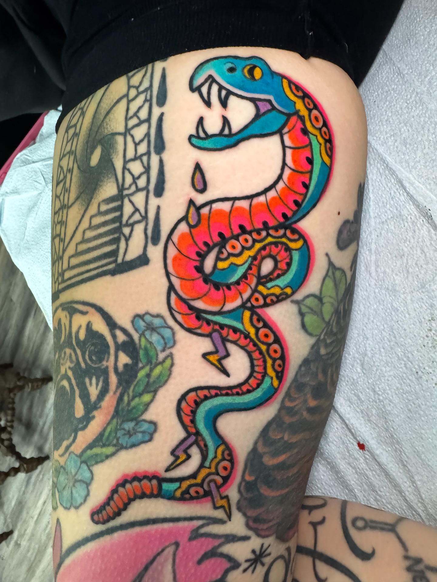 Snake American traditional tattoo on the thigh by Perrey