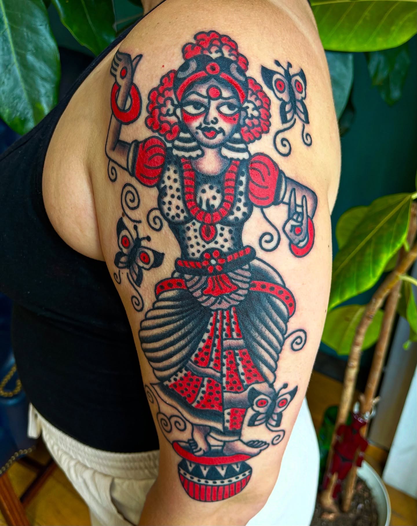 Dancer American traditional tattoo on the upper arm by Swasthik Iyengar, New York, New York
