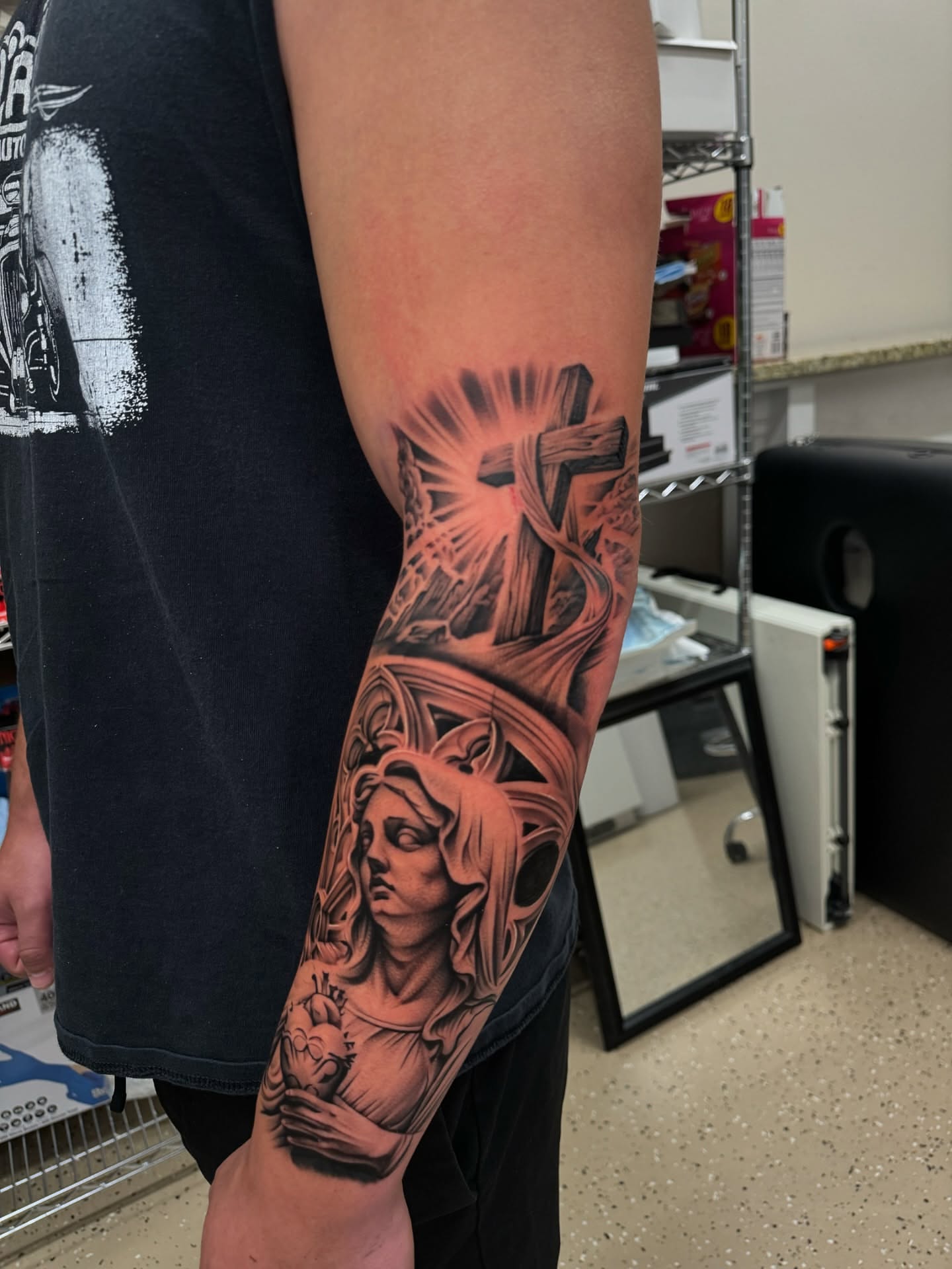 Religious iconography realism tattoo on the forearm by Ian Chancellor, Leighton Buzzard, England