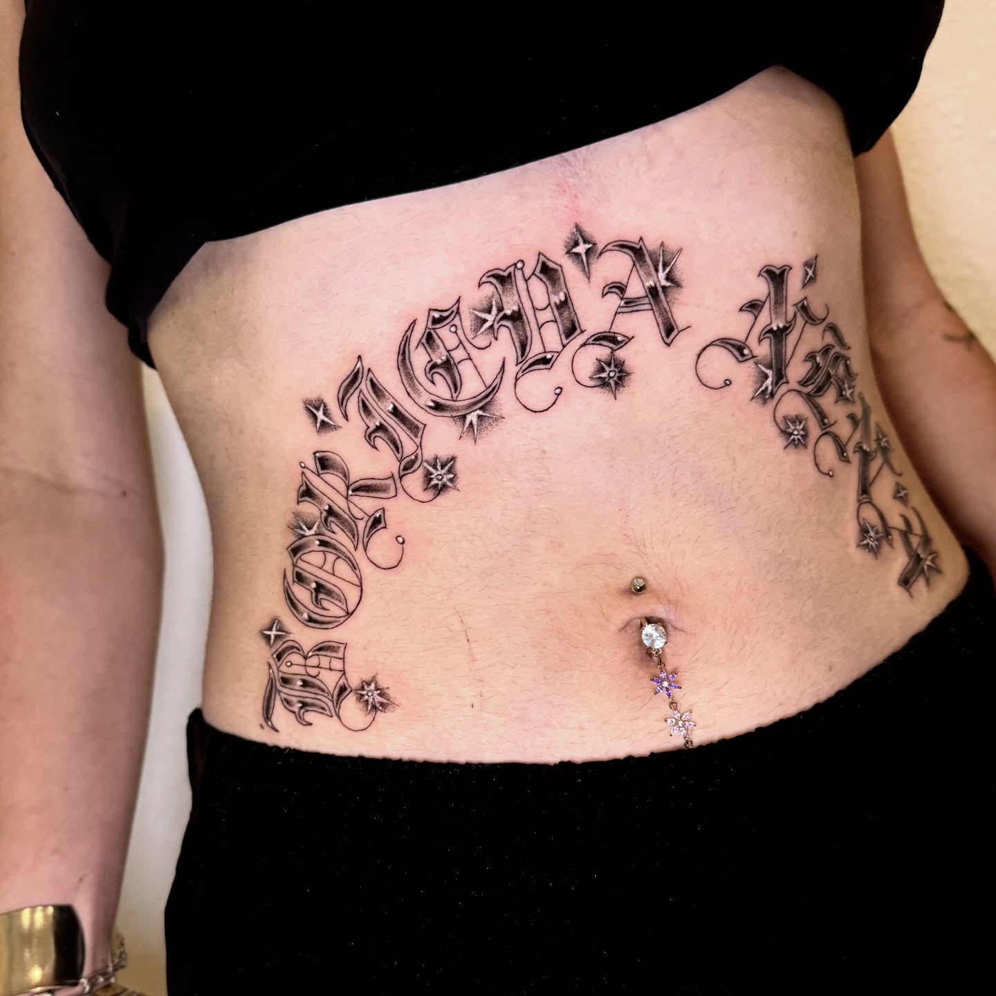 Name tattoo lettering script tattoo on the torso by @sadfoo_tattoo, Austin, Texas