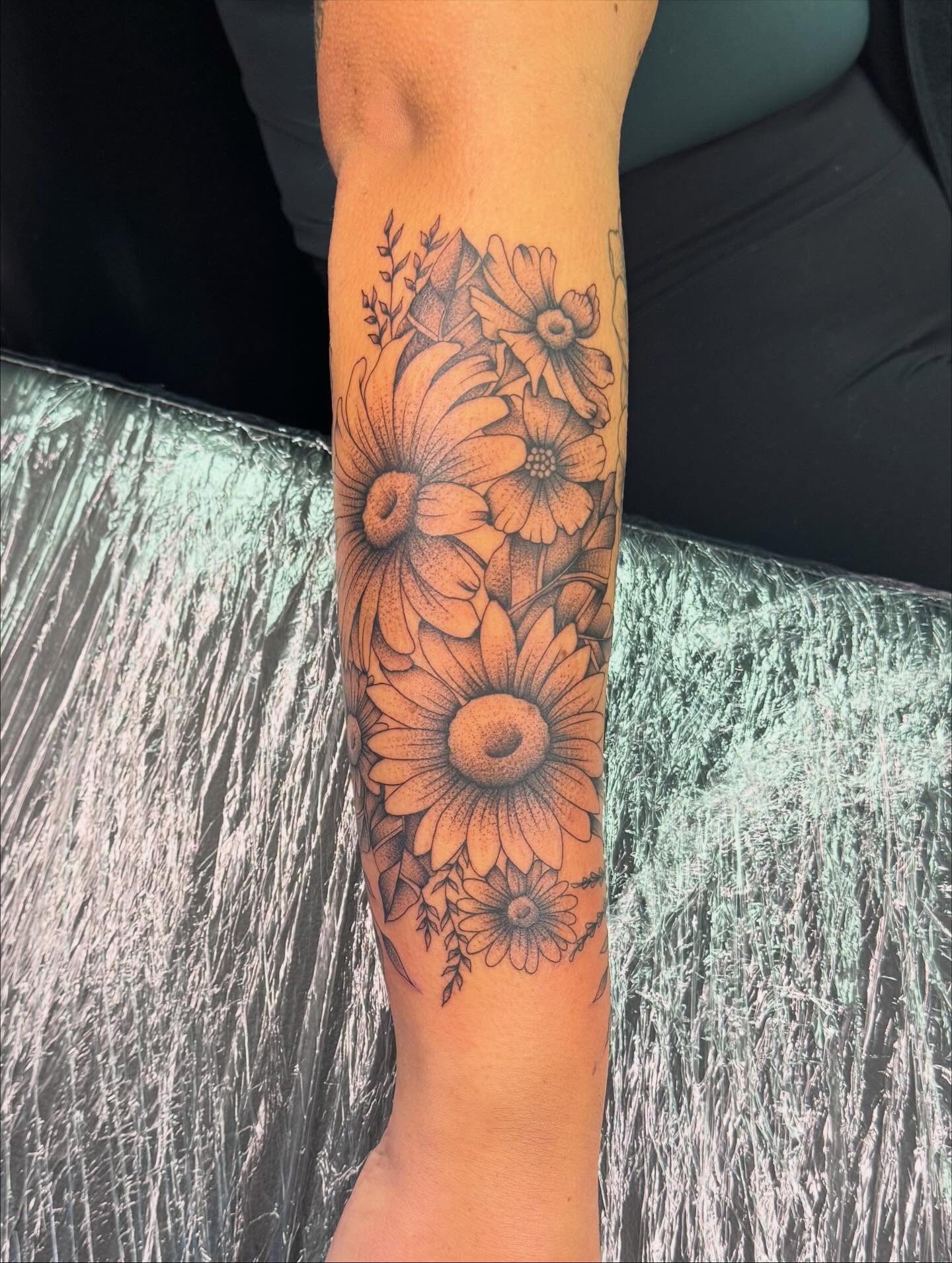 Sunflowers black and grey tattoo on the forearm by haylie