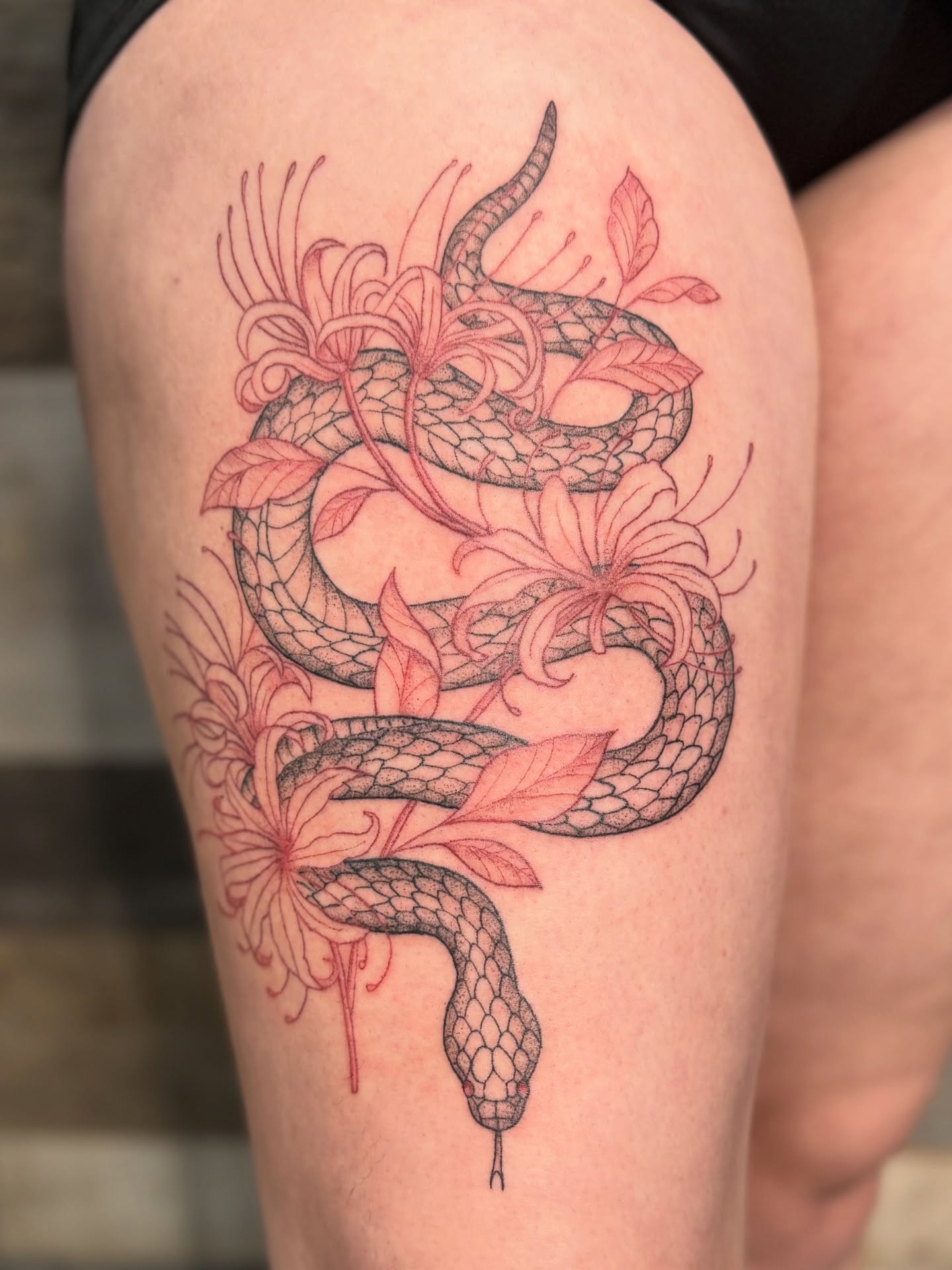 Snake and flowers dotwork tattoo on the thigh by Tina Petrullo, West Chester Township, Butler County, Ohio