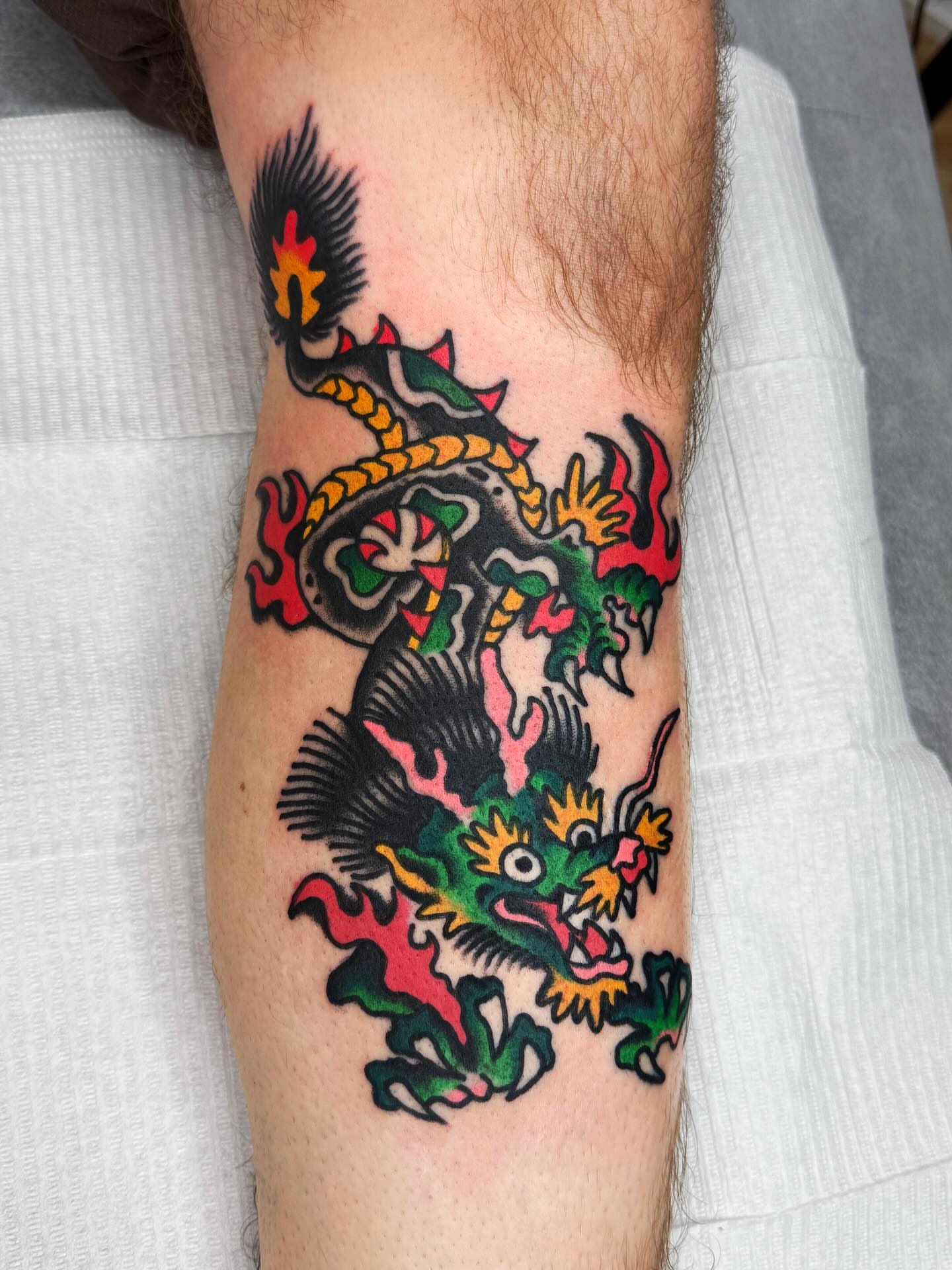Dragon American traditional tattoo on the forearm by Jimmy Ho