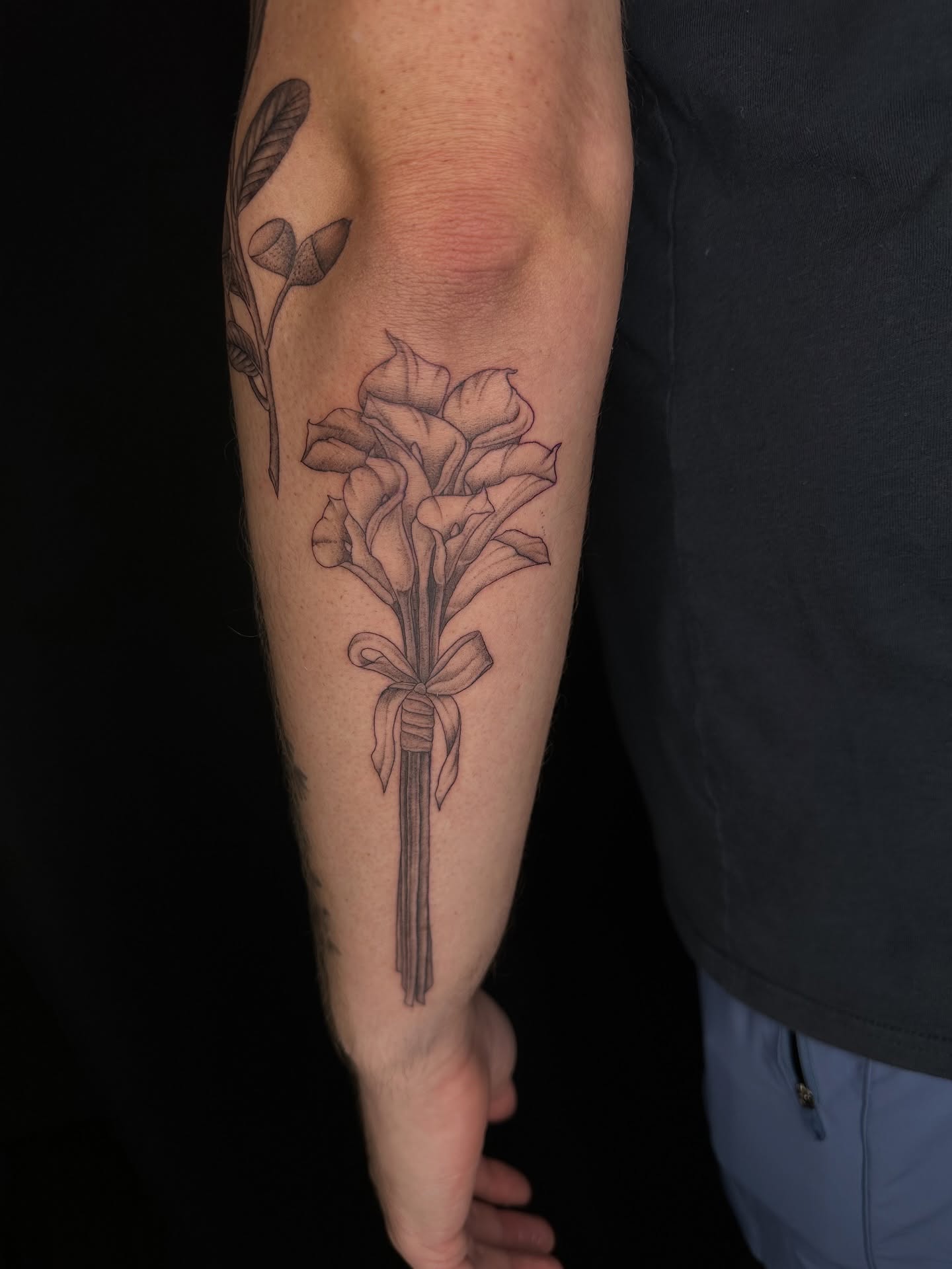 Flower bouquet black and grey tattoo on the forearm by Hail Chaney, Somerville, Massachusetts