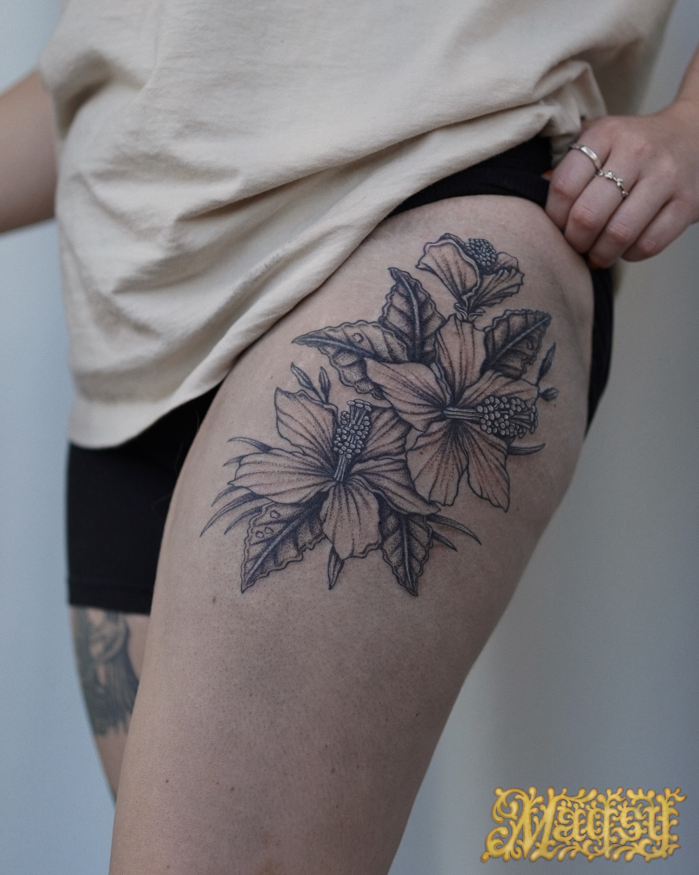Floral bouquet black and grey tattoo on the thigh by Magsy, Orange, California