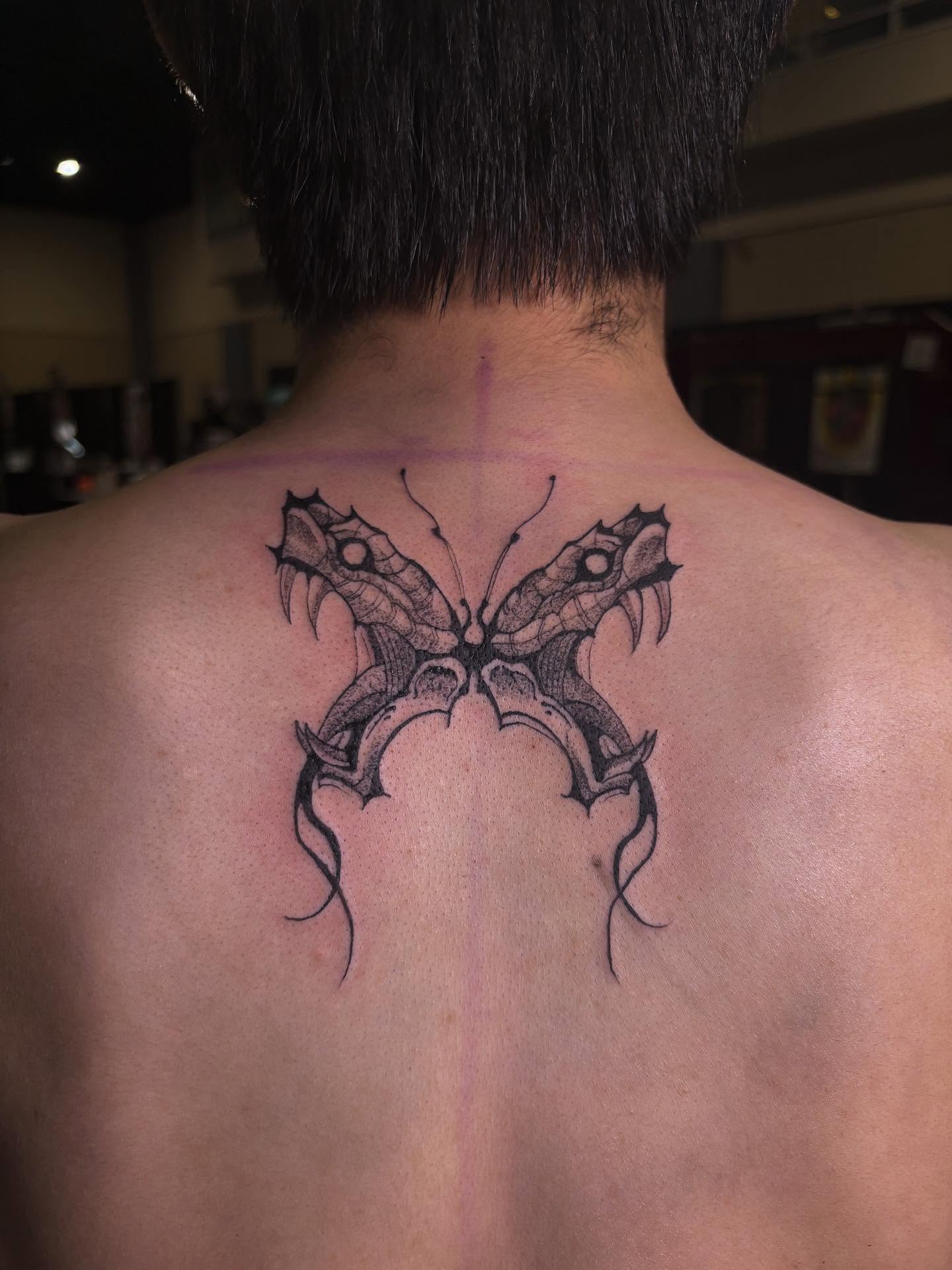 Butterfly black and grey tattoo on the back by Shampooh