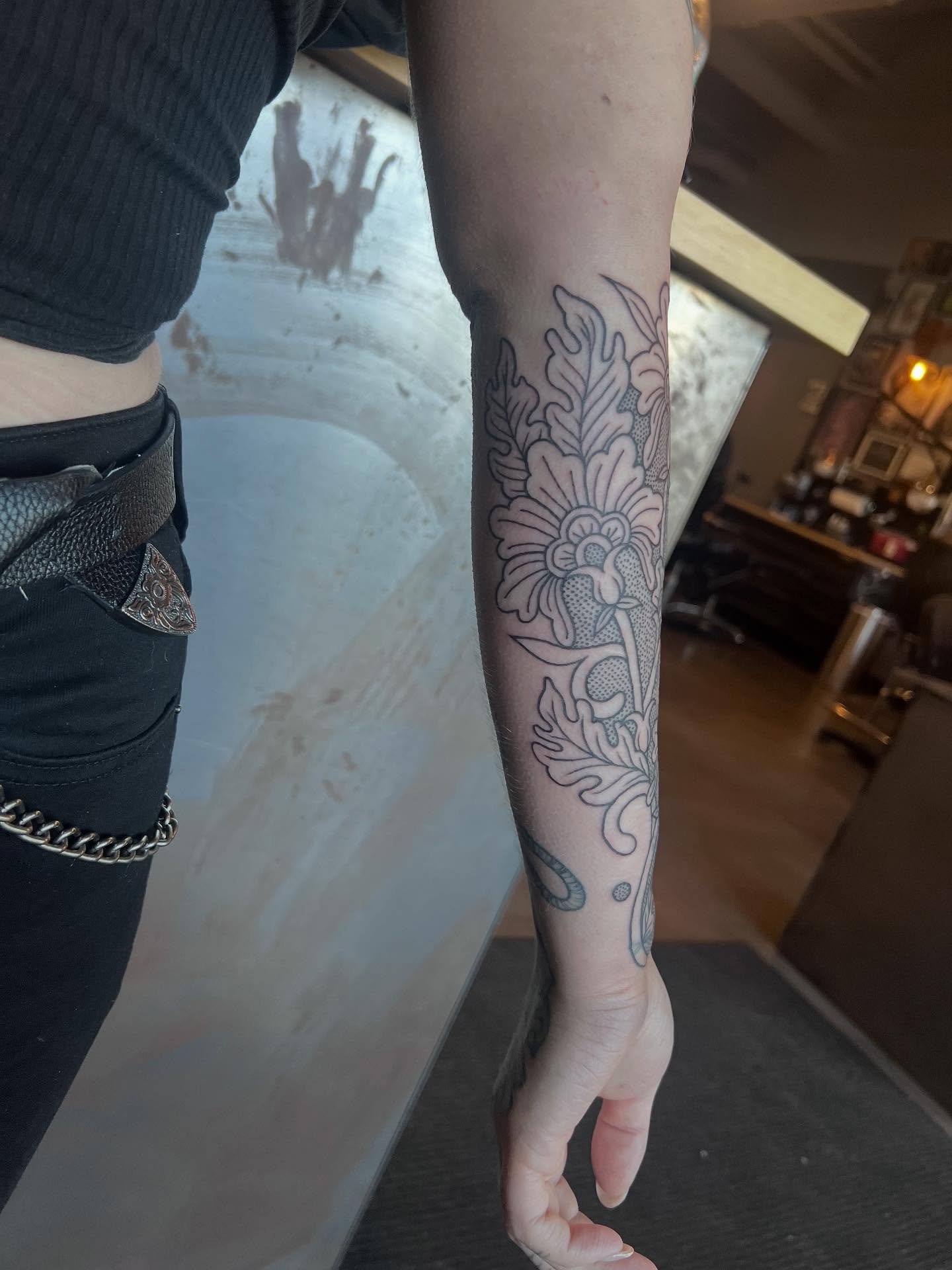 Floral design black and grey tattoo on the forearm by Siërra Nicole, Minneapolis, Minnesota