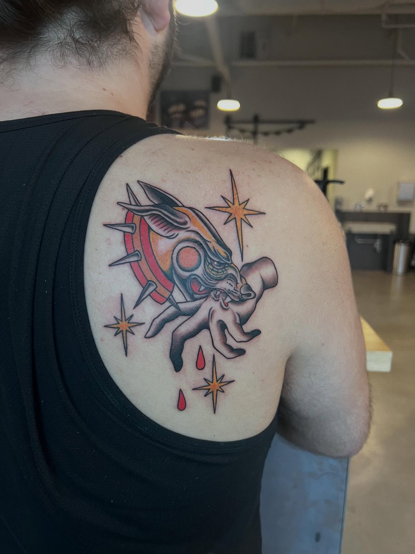 Astronaut and star American traditional tattoo on the shoulder by Siërra Nicole, Minneapolis, Minnesota