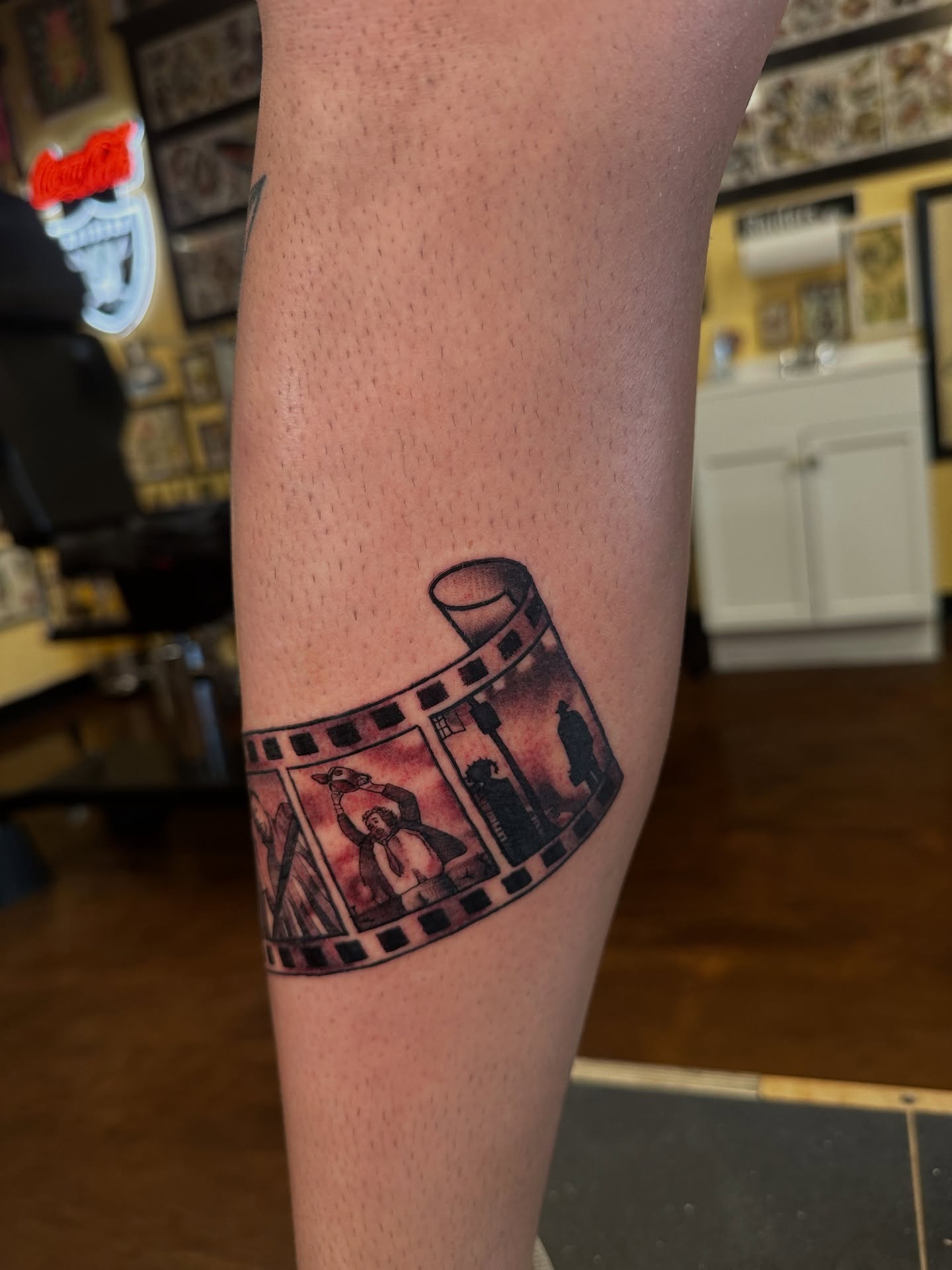 Film strip black and grey tattoo on the forearm by Nick Bones, Las Vegas, Nevada