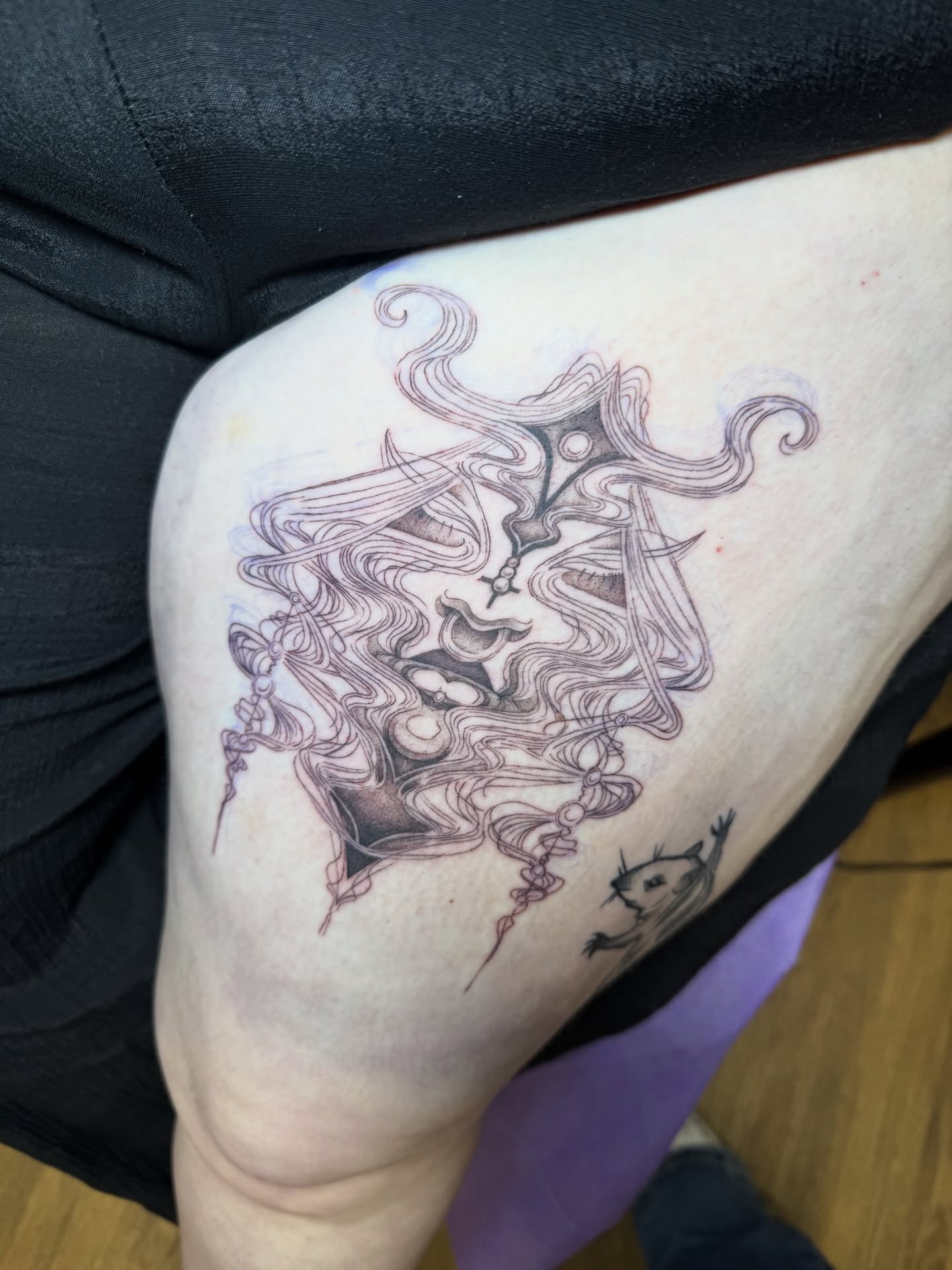 Woman with flowing hair realism tattoo on the thigh by z o y a, Seattle, Washington