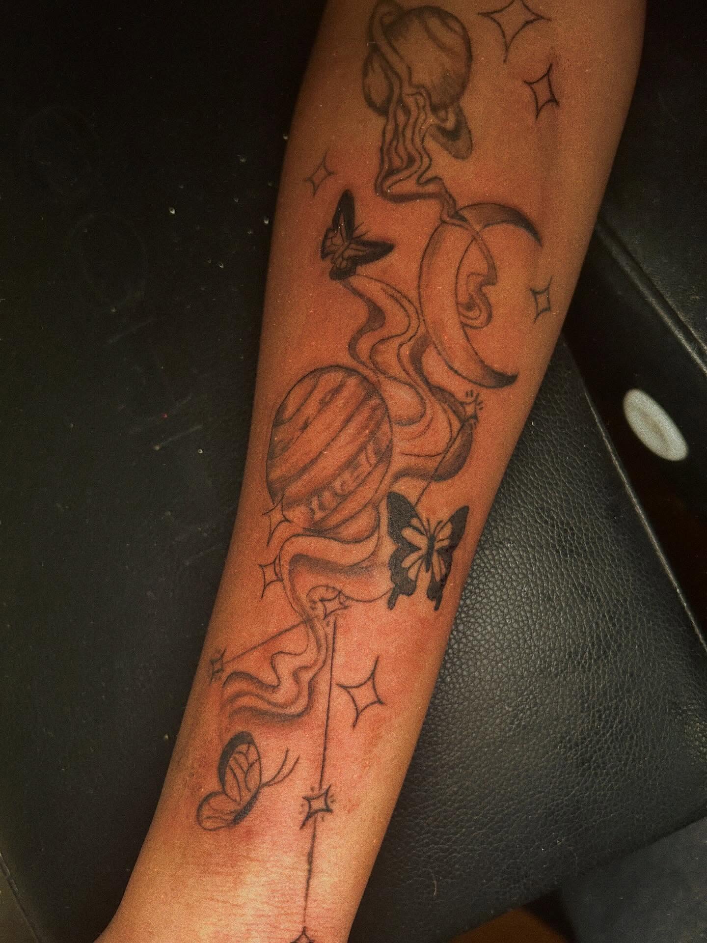 Astronomy-themed black and grey tattoo on the forearm by Detroit tattoo Artist
