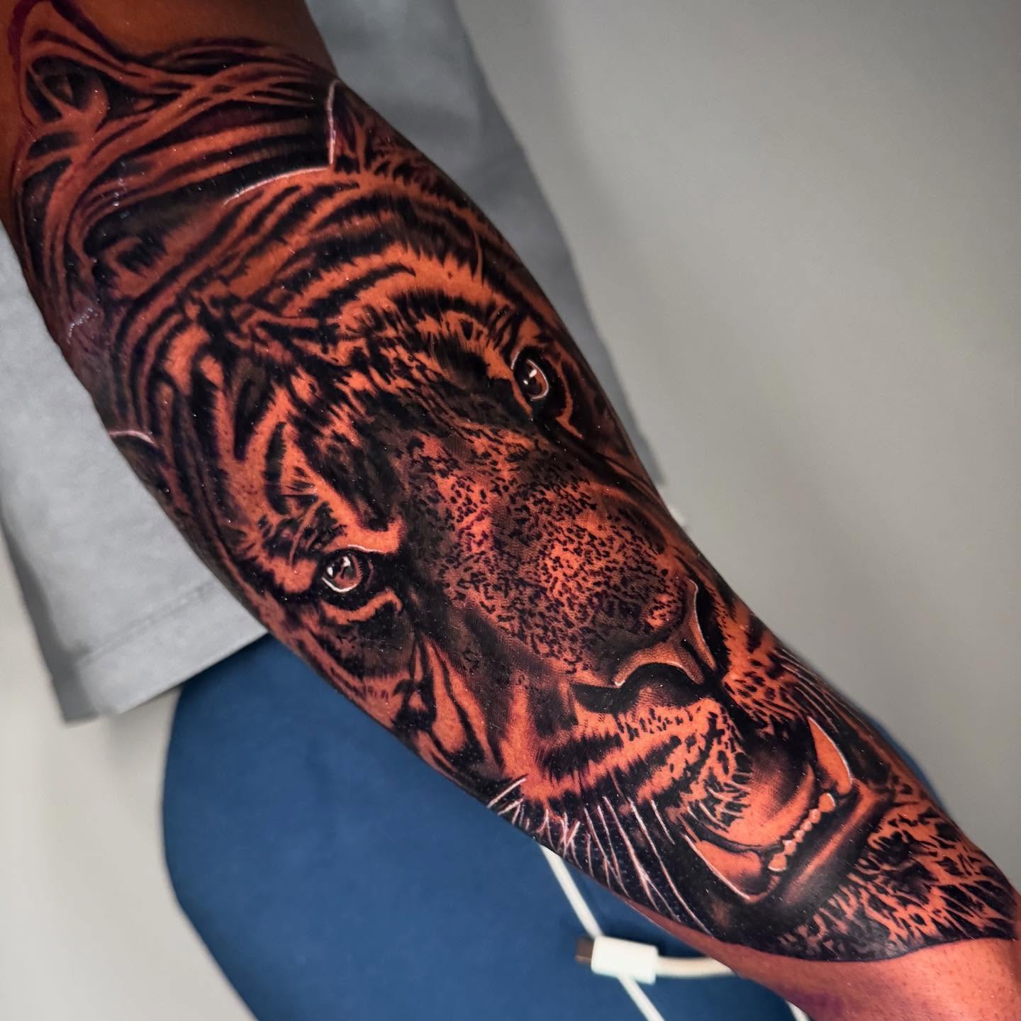 Tiger realism tattoo on the forearm by Drink Ink Tattoos™ 👽