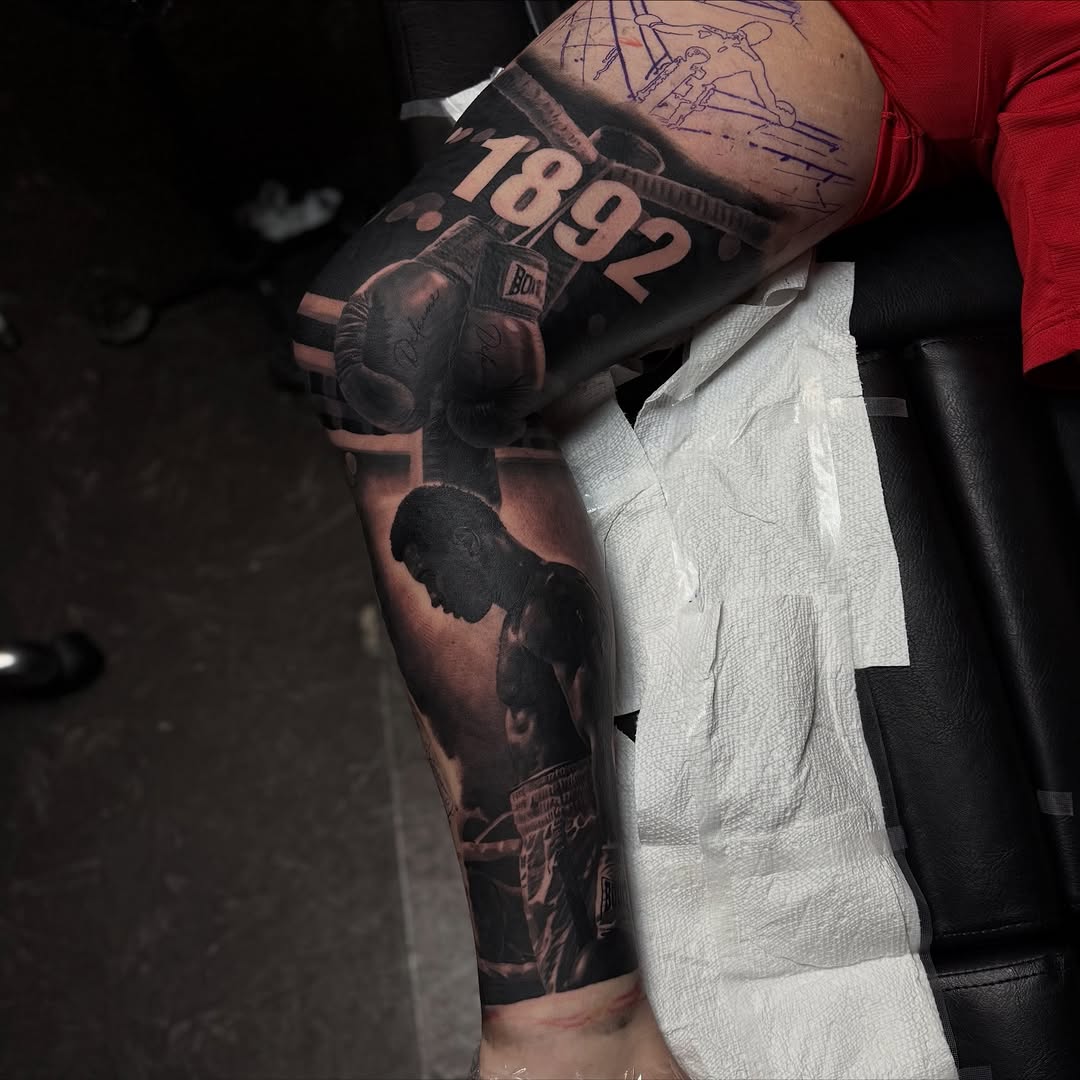 Boxer and boxing gloves surrealism tattoo on the forearm by Angels tattoo