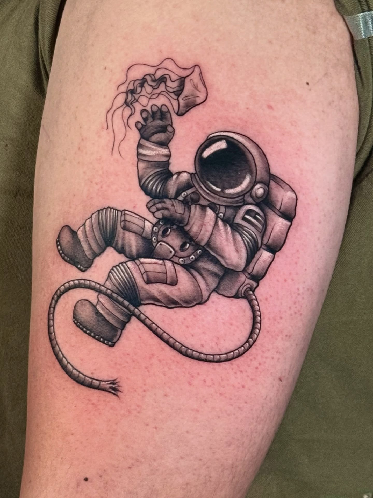 Astronaut realism tattoo on the forearm by HAiZiE
