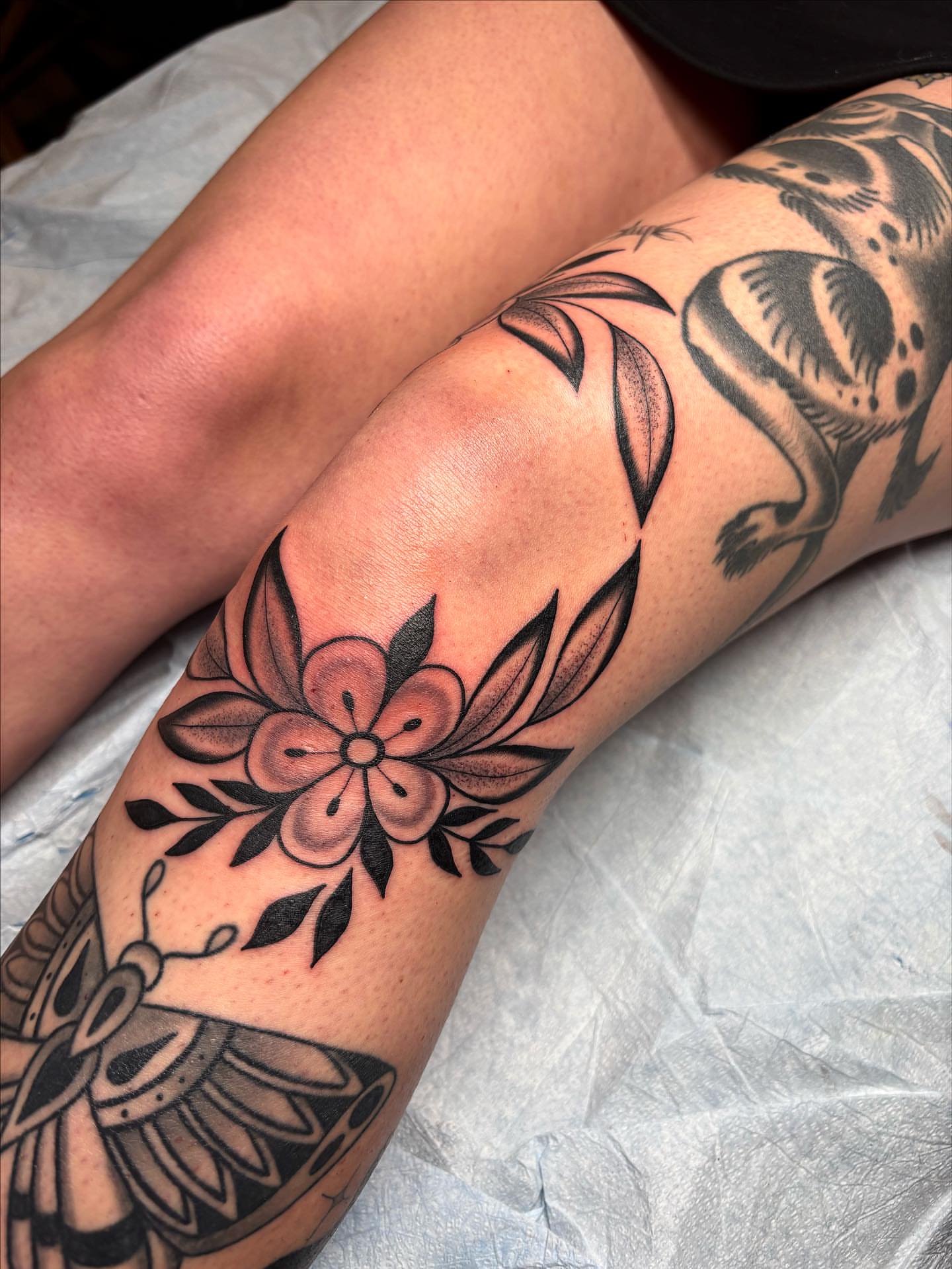 Flower American traditional tattoo on the forearm by Victoria Bacon