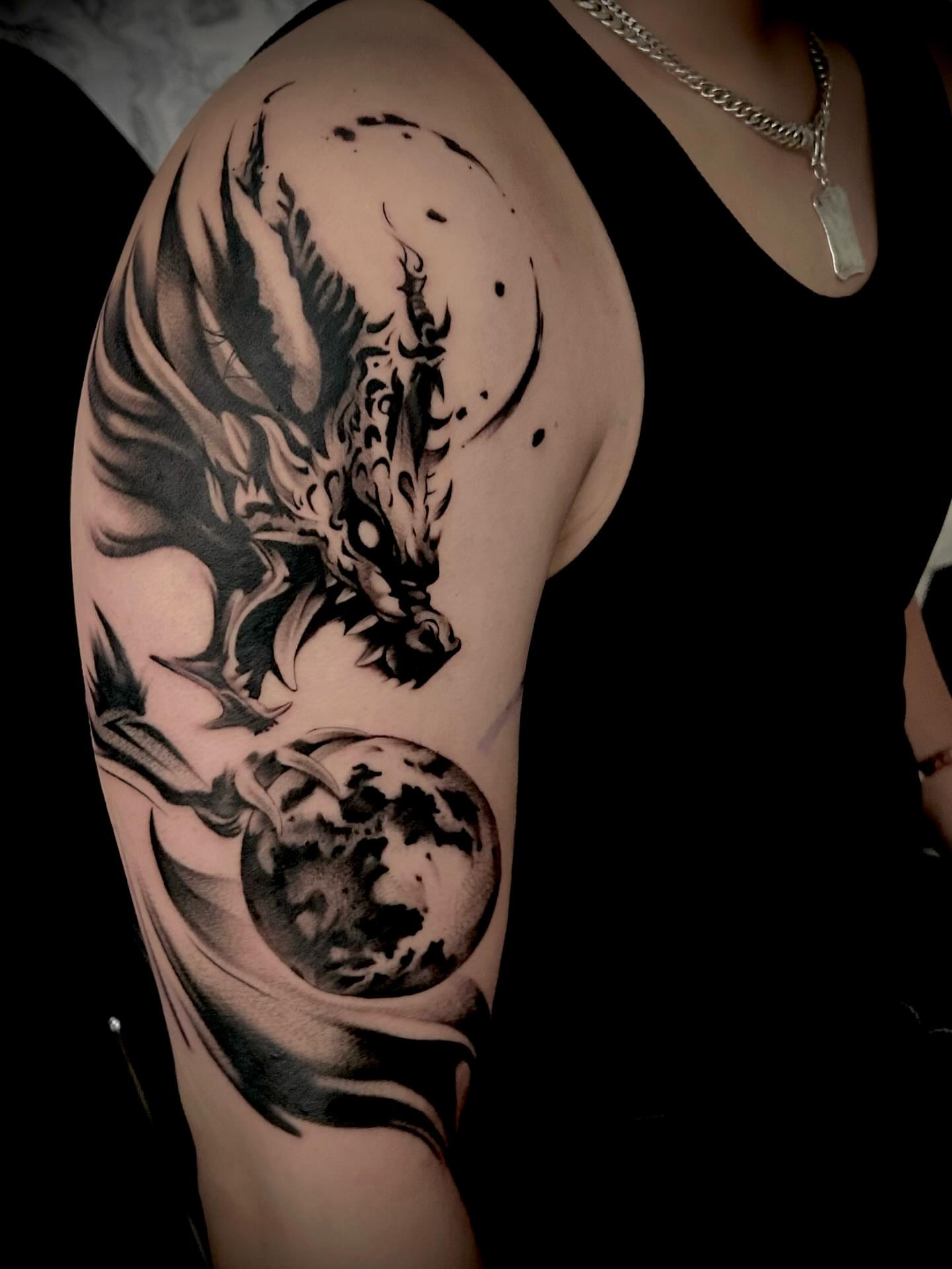 Dragon and moon realism tattoo on the shoulder by Jonny Tattoo PHX AZ