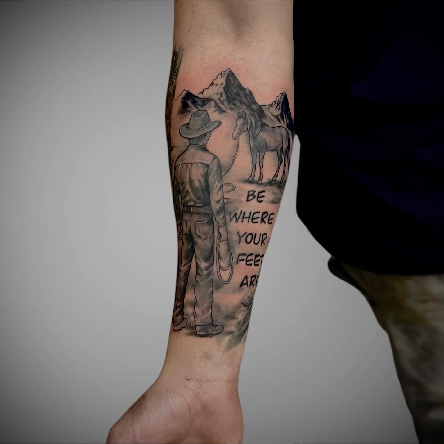 Mountain landscape realism tattoo on the forearm by Mitsuko Ching