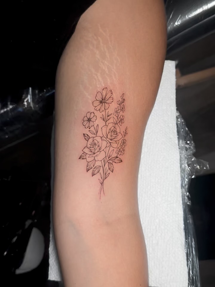 Floral bouquet fine line tattoo on the forearm by Houston Tattoo🇺🇸👩🏻‍🎨💉