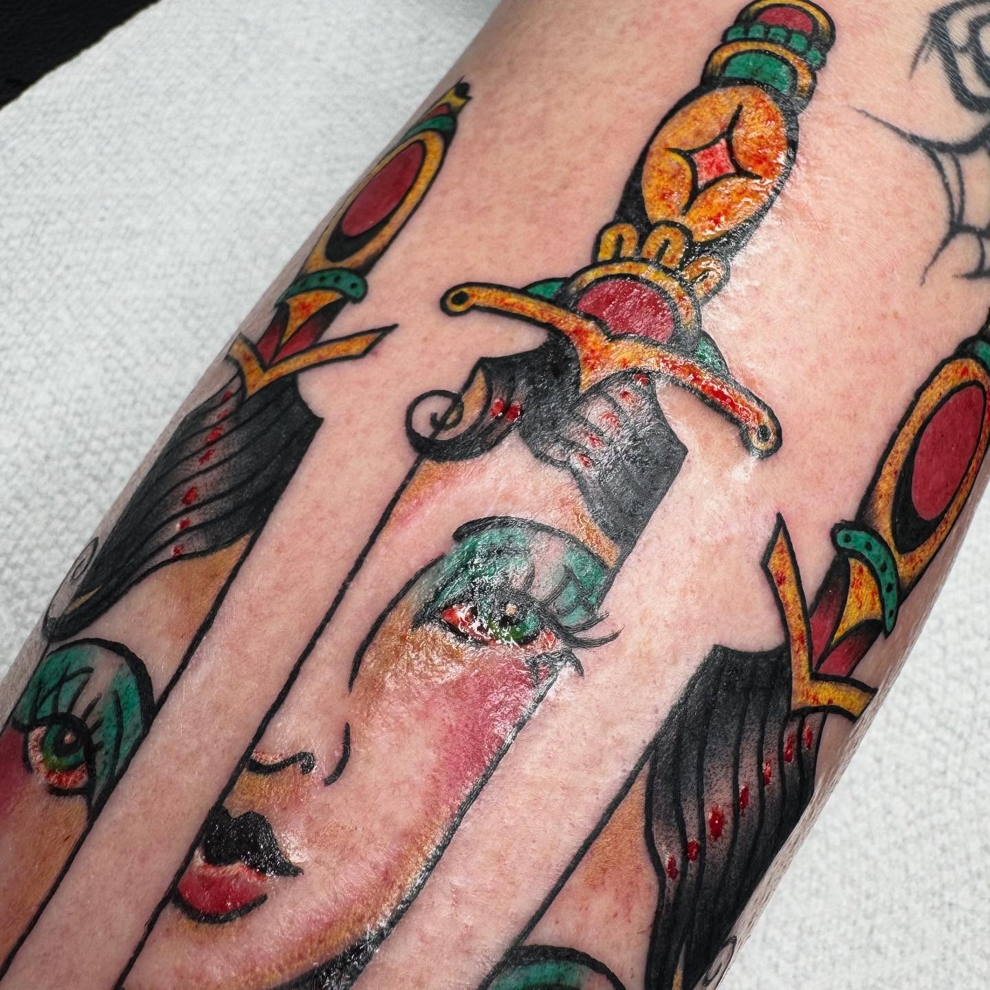Woman's face with dagger American traditional tattoo on the forearm by 𝕷𝖊𝖝𝖎 𝕽𝖚𝖓𝖞𝖔𝖓