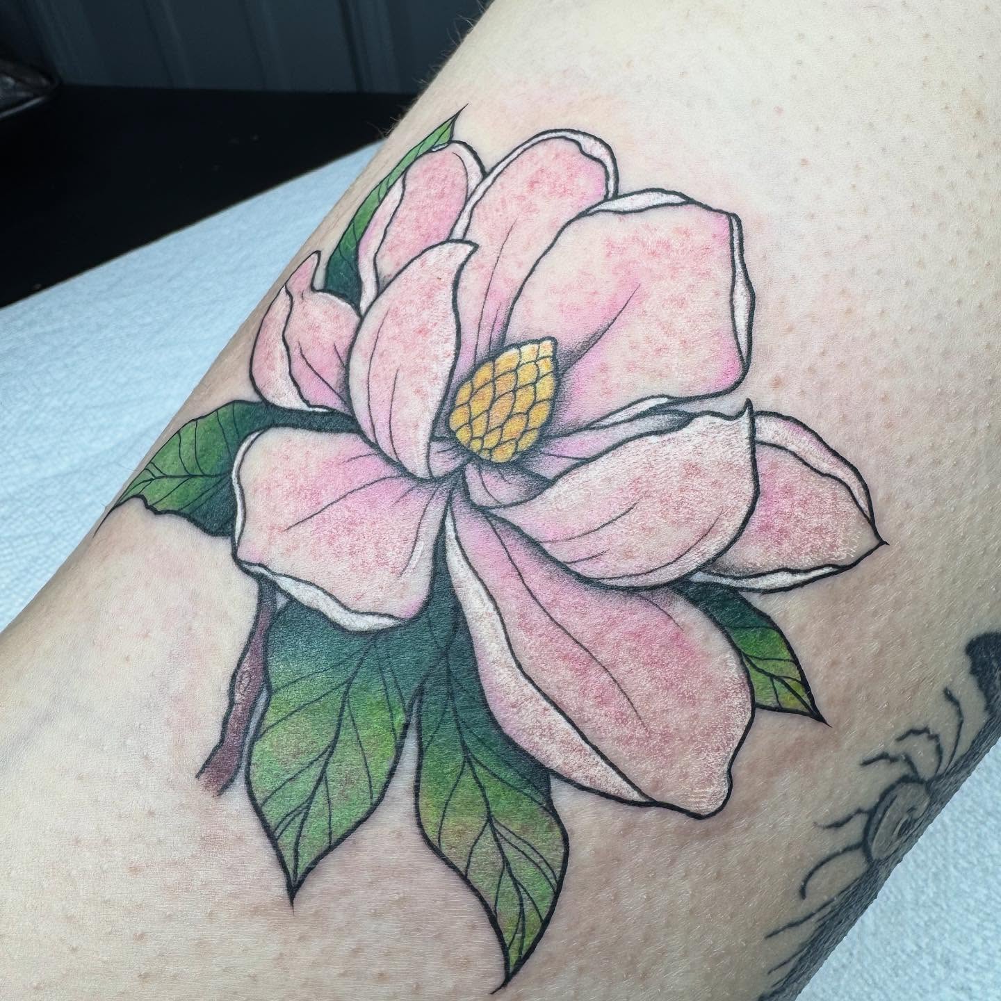 Magnolia flower realism tattoo on the forearm by 𝕷𝖊𝖝𝖎 𝕽𝖚𝖓𝖞𝖔𝖓