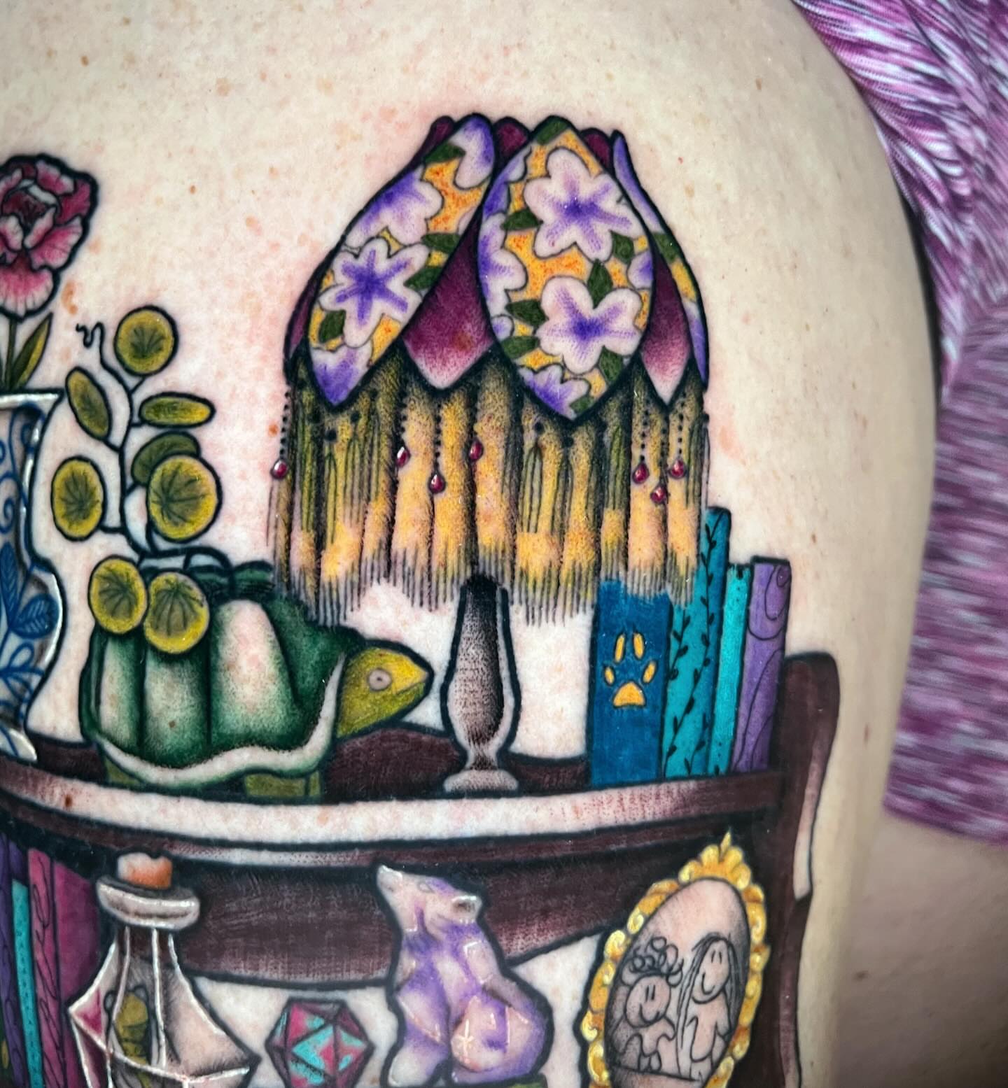 Houseplant and bookshelf illustrative tattoo on the upper arm by rocky love