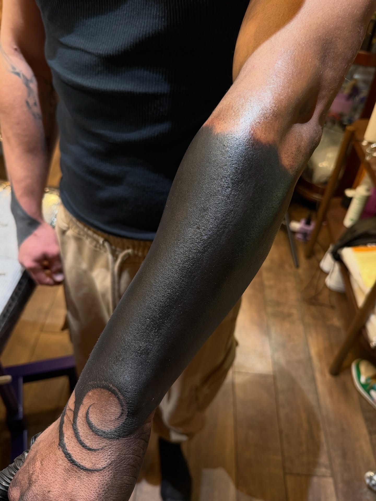Swirl black and grey tattoo on the forearm by Denver Blackout Tattoo Specialist - Anthony