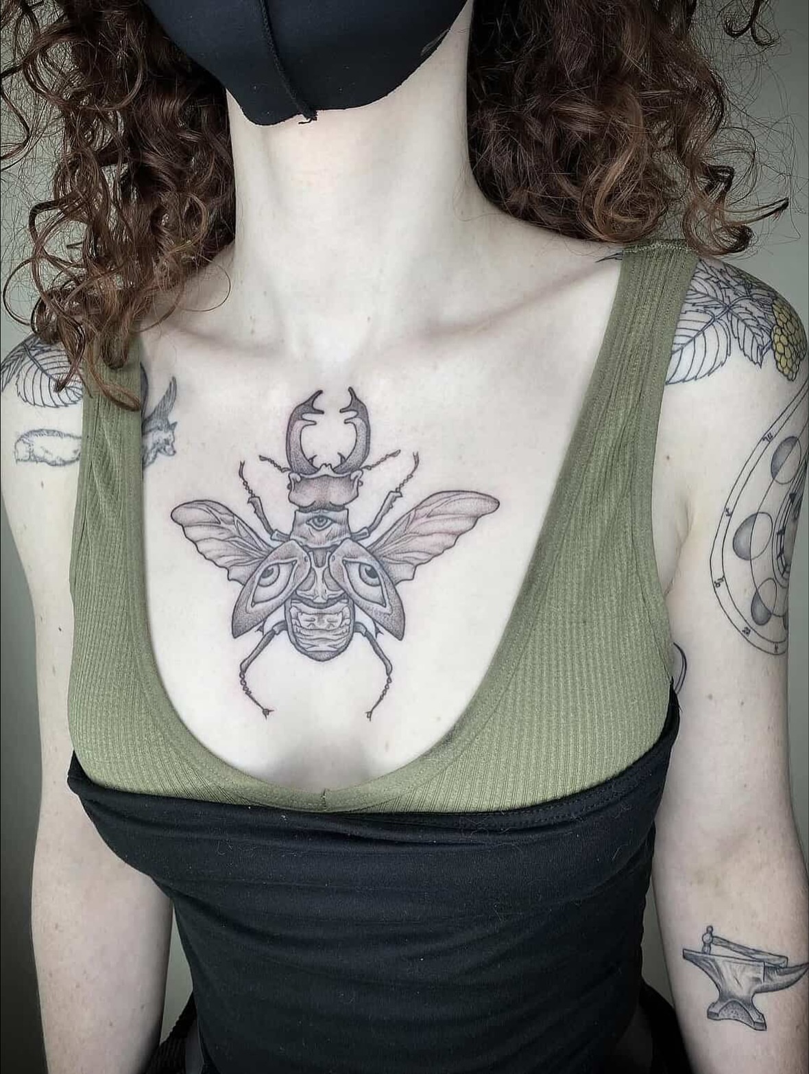 Insect black and grey tattoo on the chest by Carmen Figueroa, New York, New York