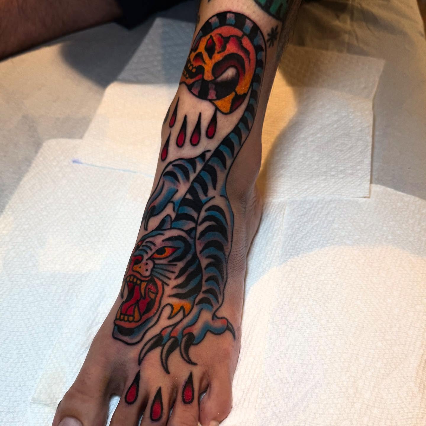 Tiger American traditional tattoo on the foot by Julia Louise