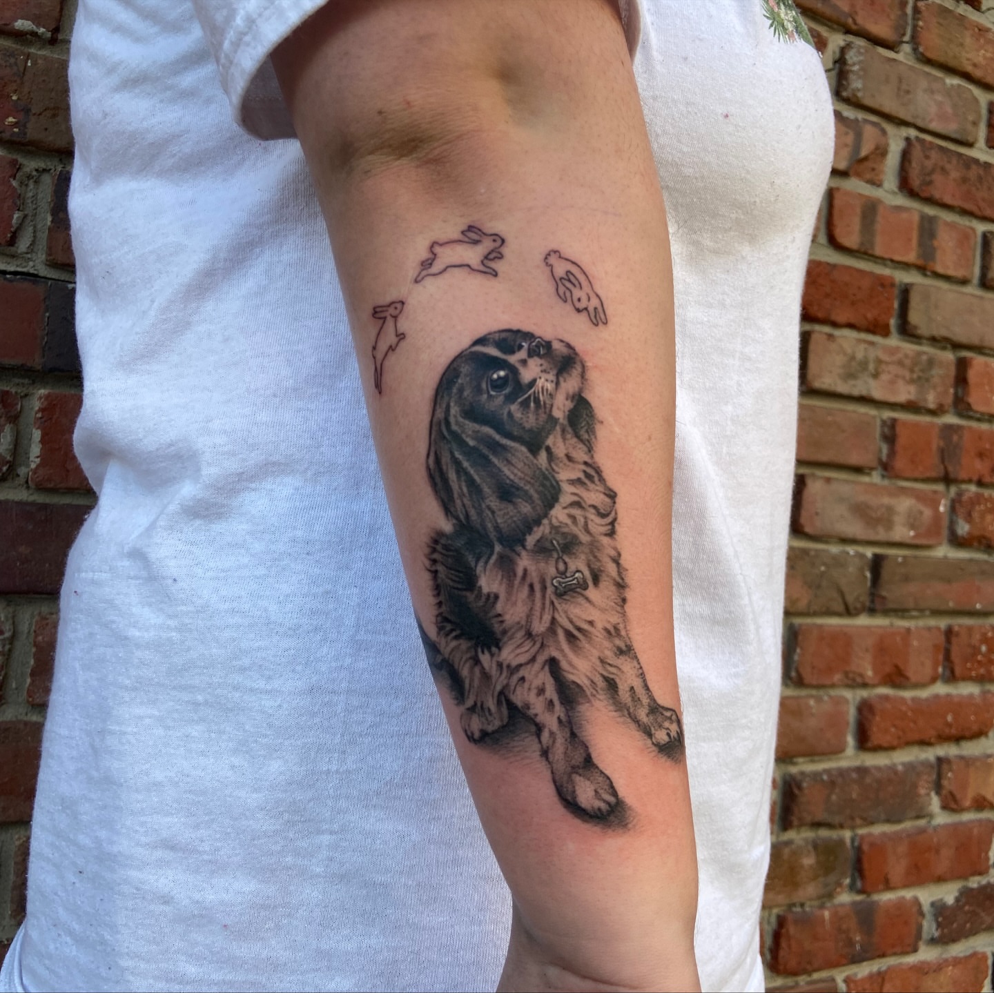 Dog realism tattoo on the forearm by Anthony Robles