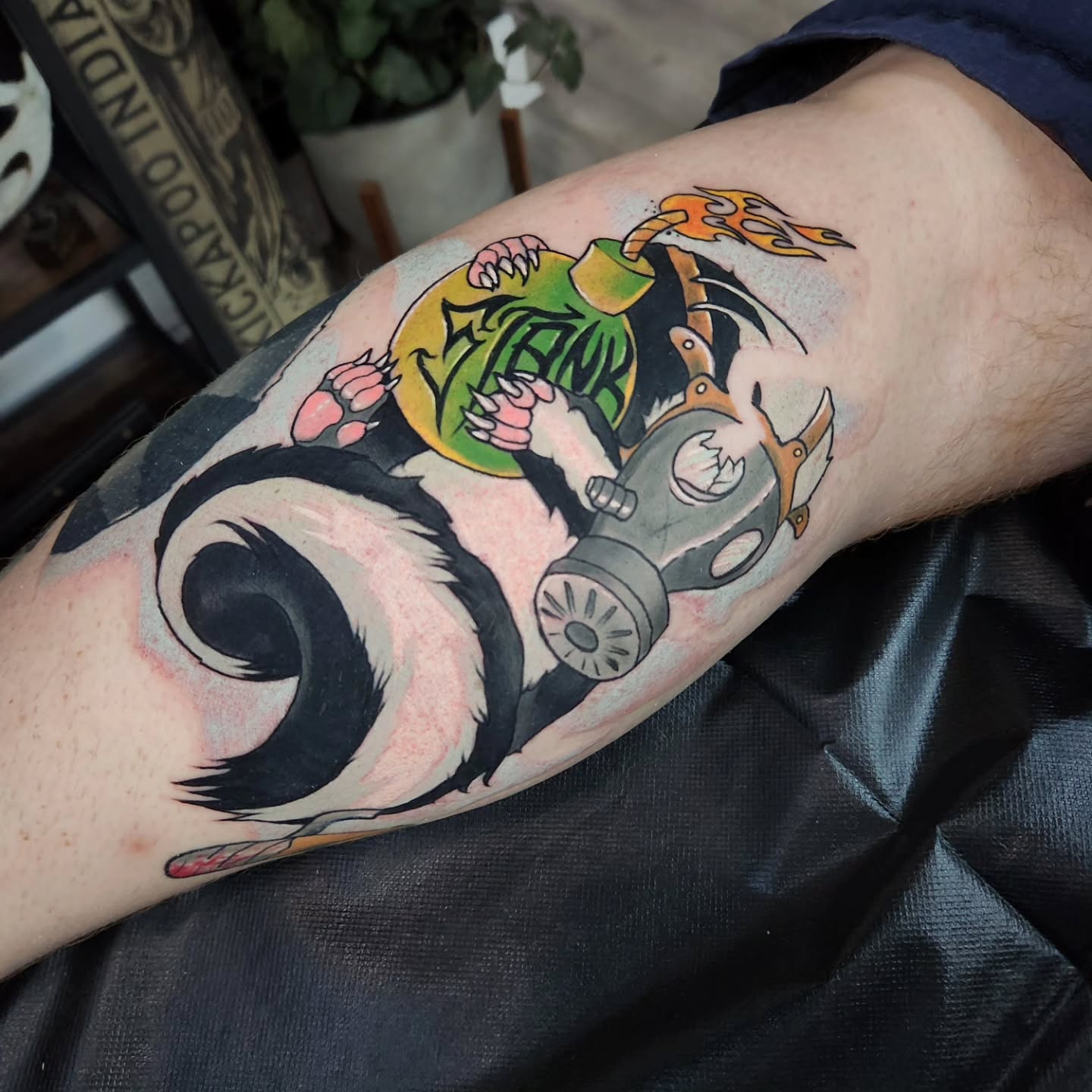 Skunk with gas mask and bomb tattoo on the forearm by Geo