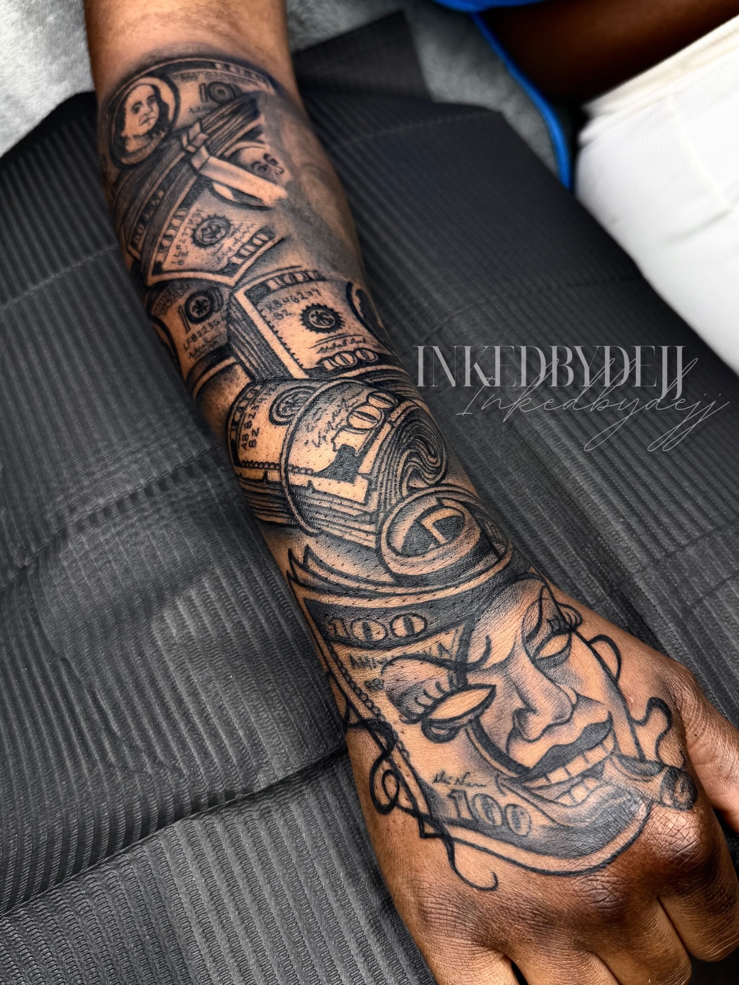 Money and face black and grey tattoo on the forearm by Inkedbydejj