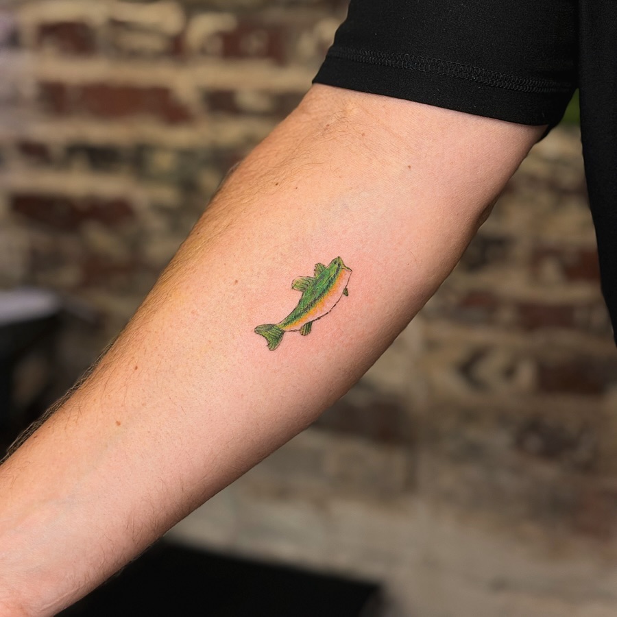 Fish realism tattoo on the forearm by justin