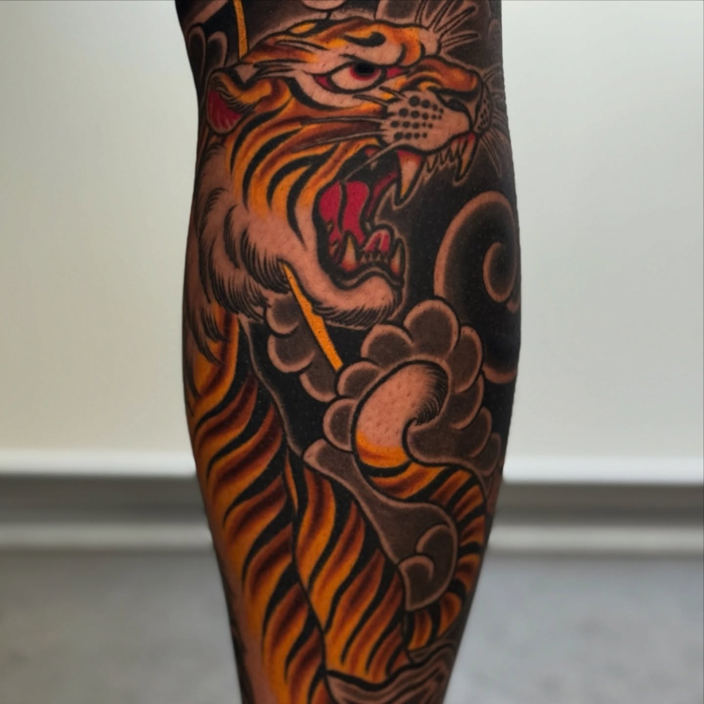 Tiger American traditional tattoo on the forearm by Mario Arcila