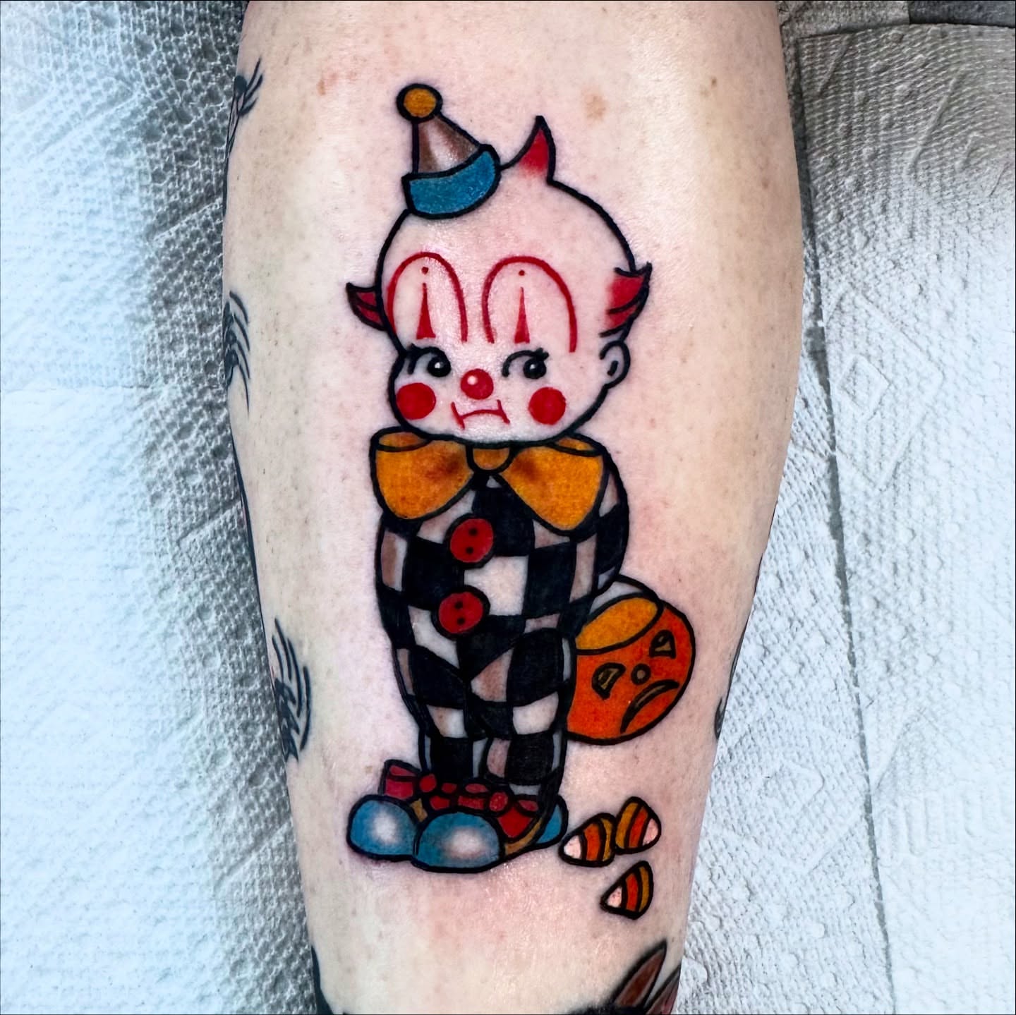 Clown American traditional tattoo on the forearm by Lisa Del Toro