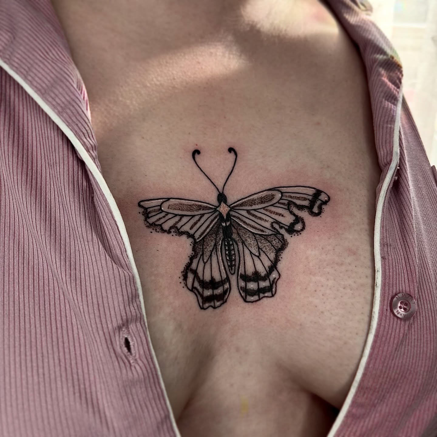 Butterfly dotwork tattoo on the chest by destiney rose