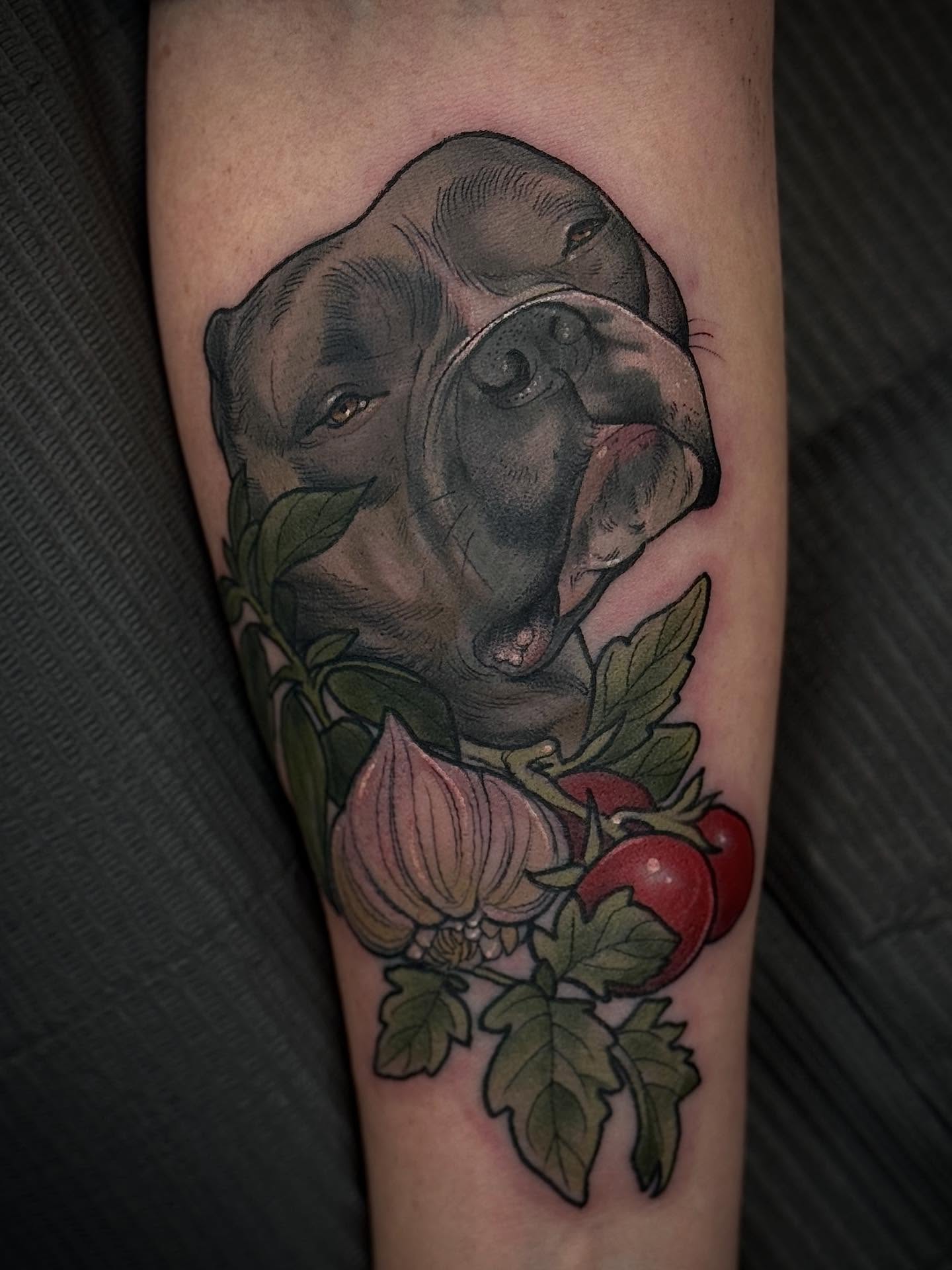 Pitbull and flowers realism tattoo on the forearm by Rachael Shelly